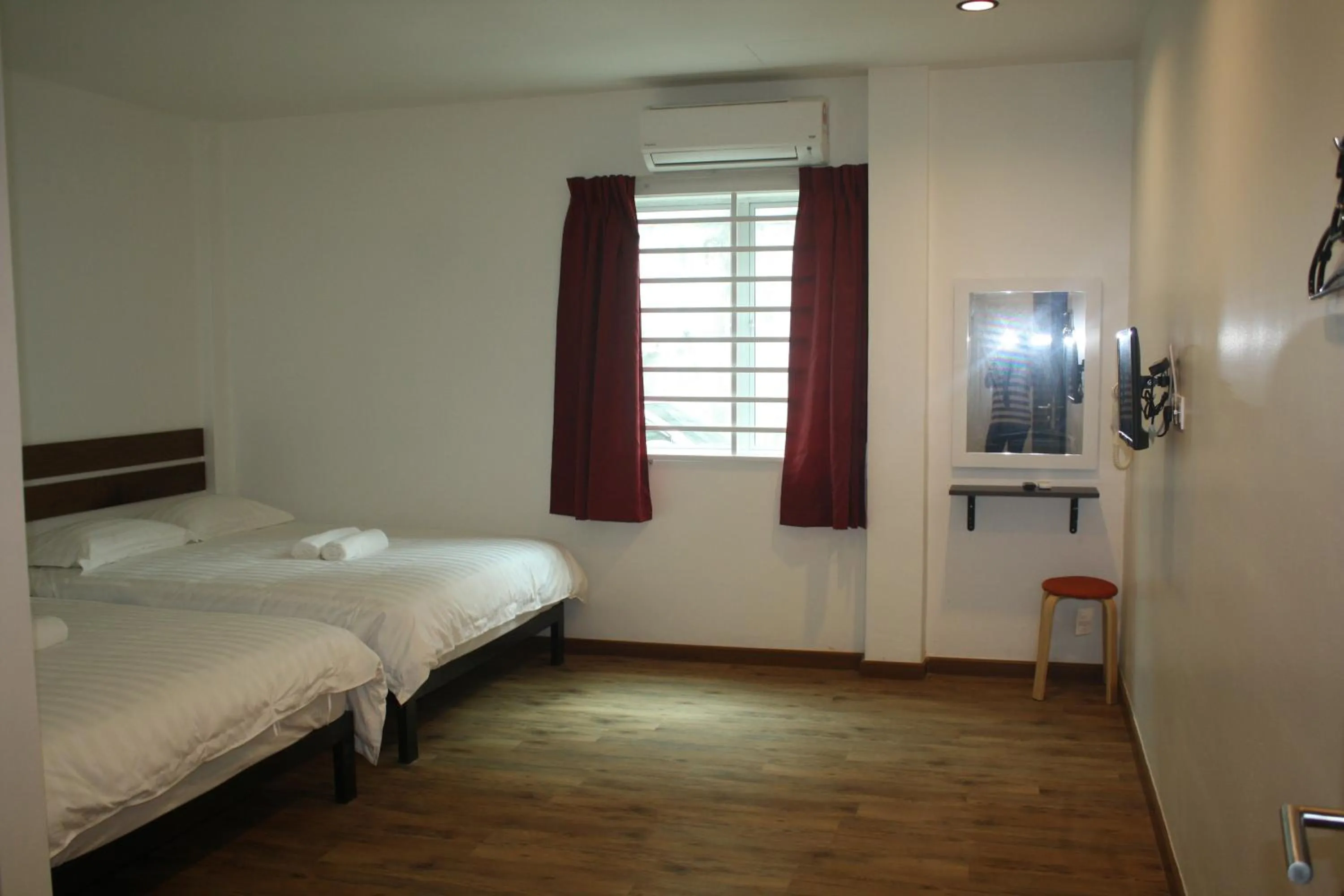 Bed in Cozy Riverside Hotel