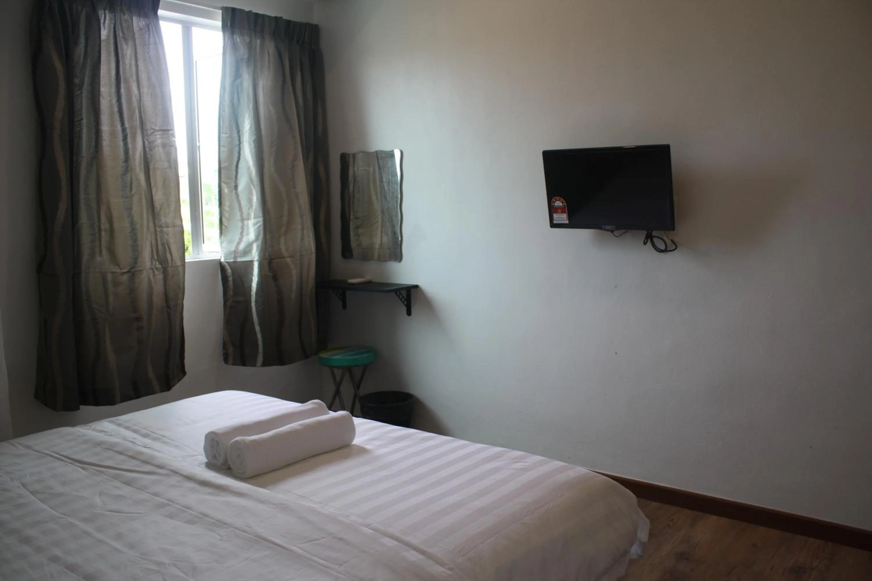 Bed in Cozy Riverside Hotel
