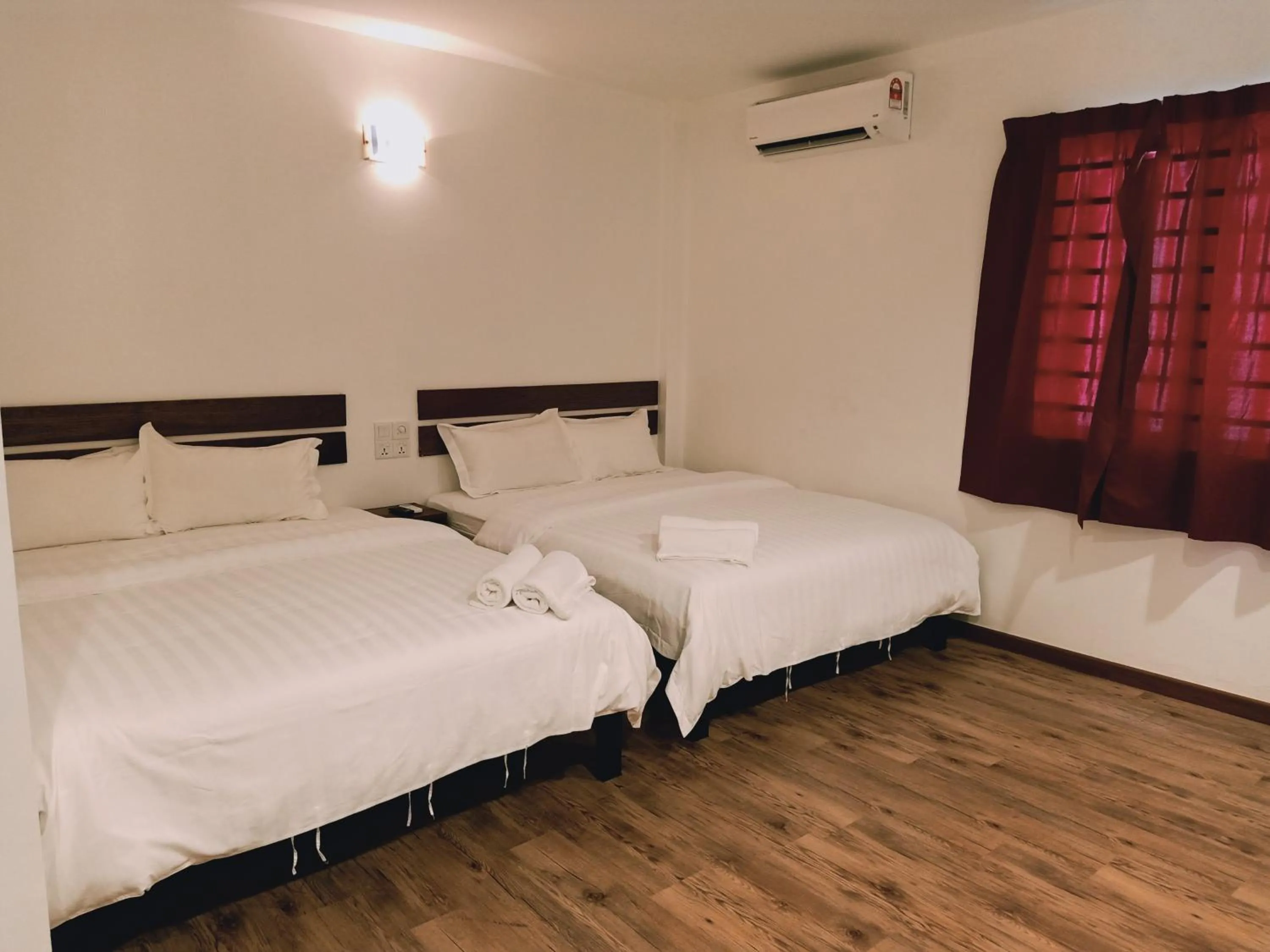 Bed in Cozy Riverside Hotel