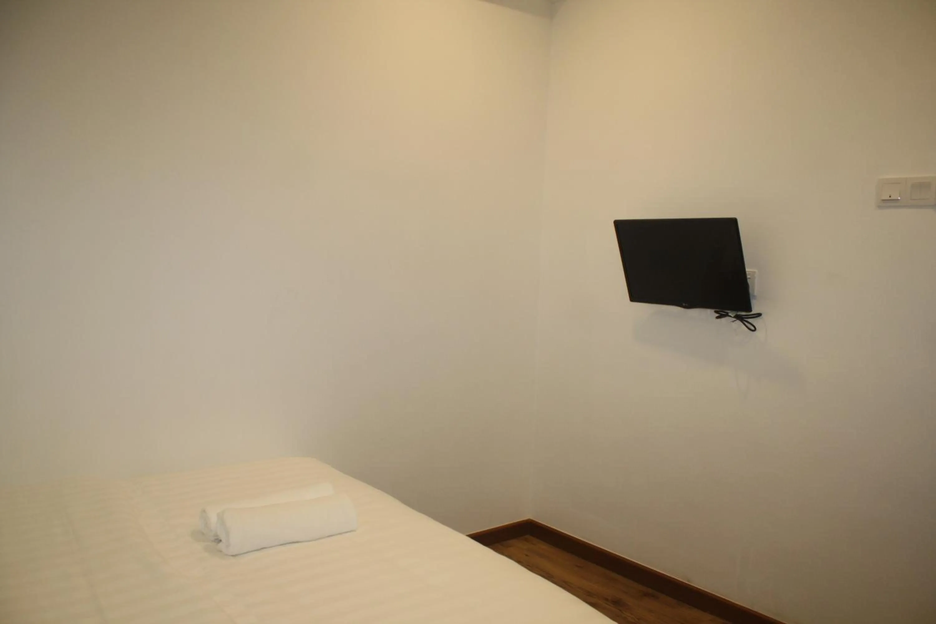 Bed in Cozy Riverside Hotel