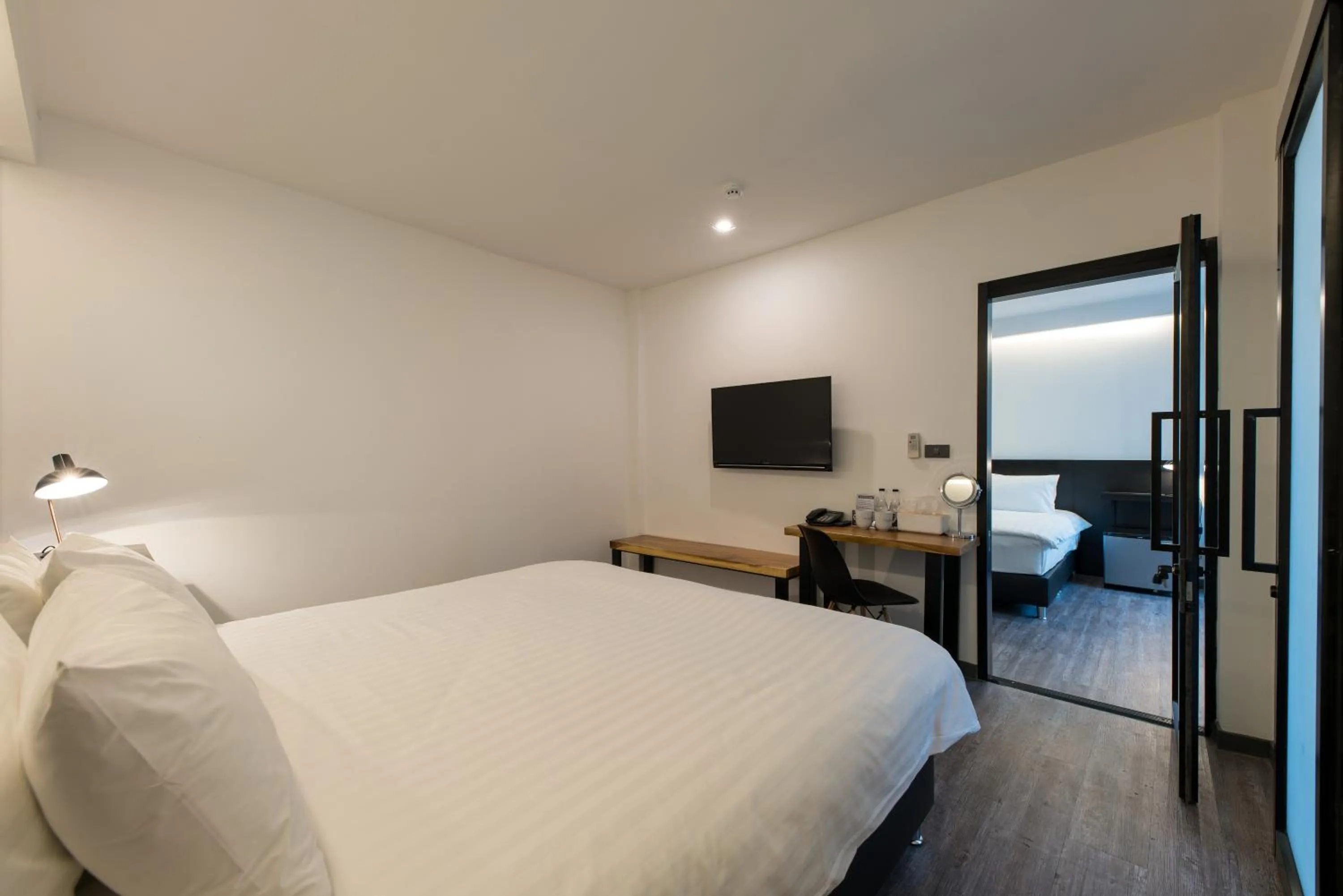 Photo of the whole room, Bed in The Nimman Hotel - SHA Plus