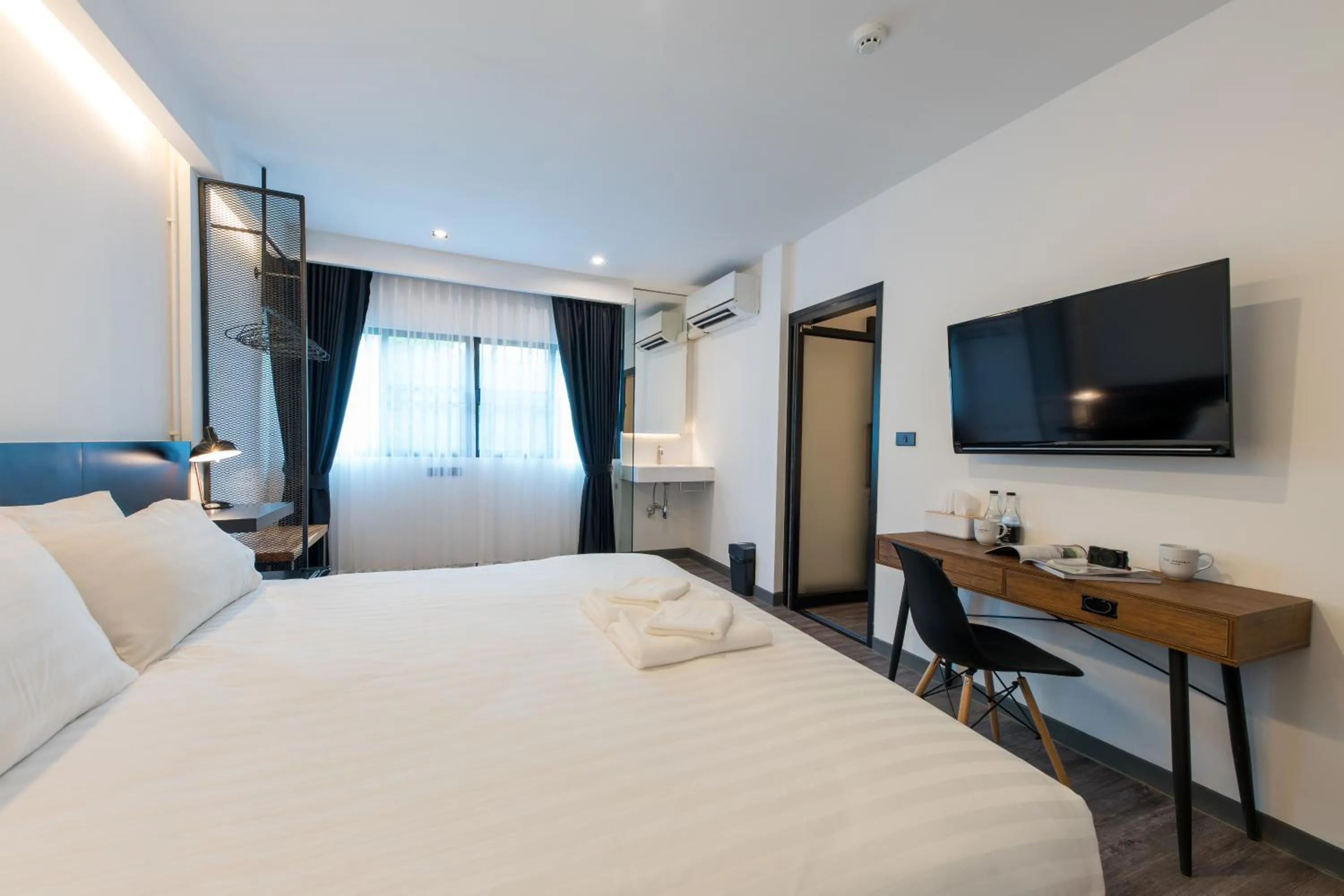 Photo of the whole room, Bed in The Nimman Hotel - SHA Plus