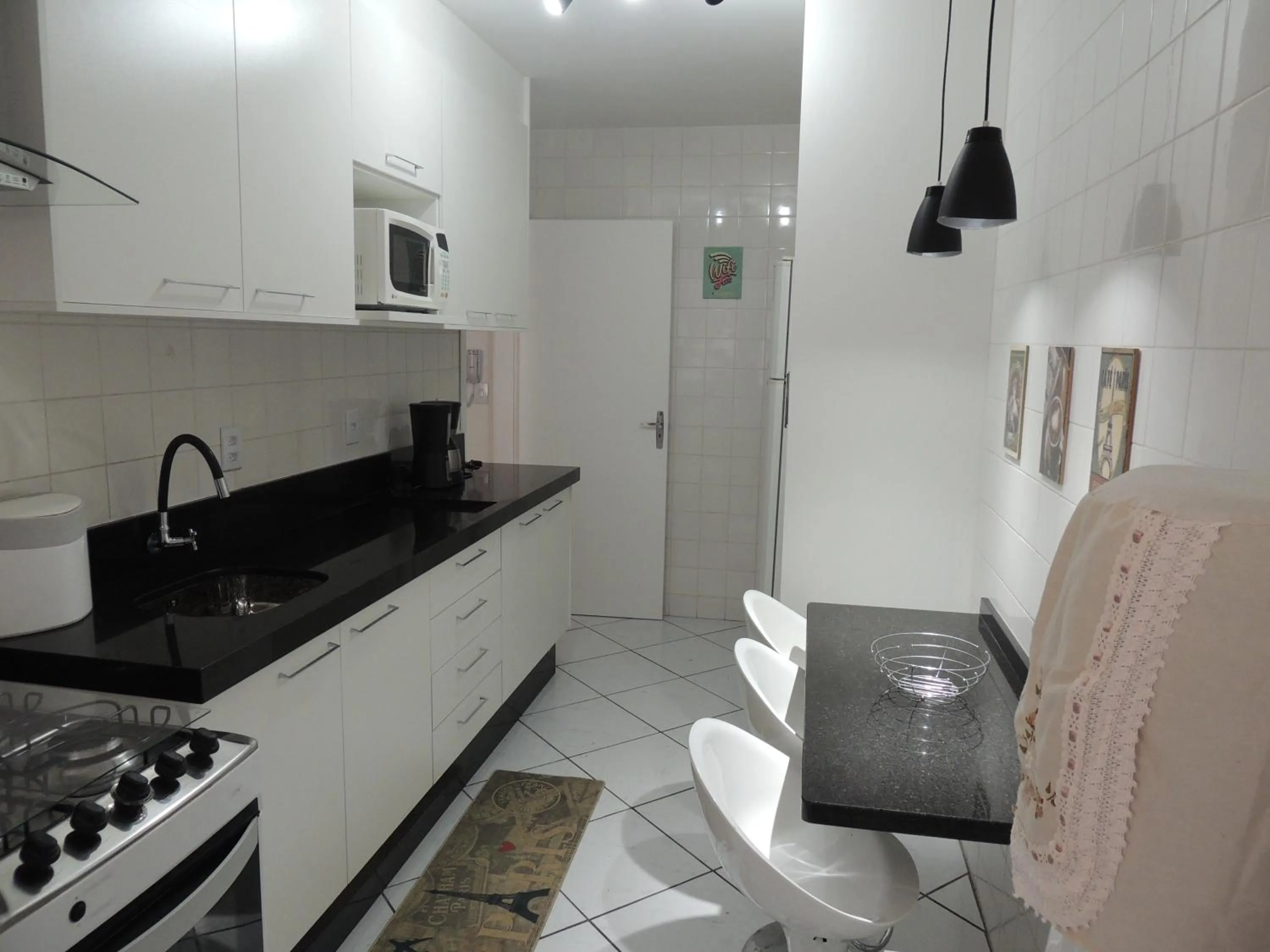 Kitchen or kitchenette in Apartamento Confortavel em Balneário Camboriu