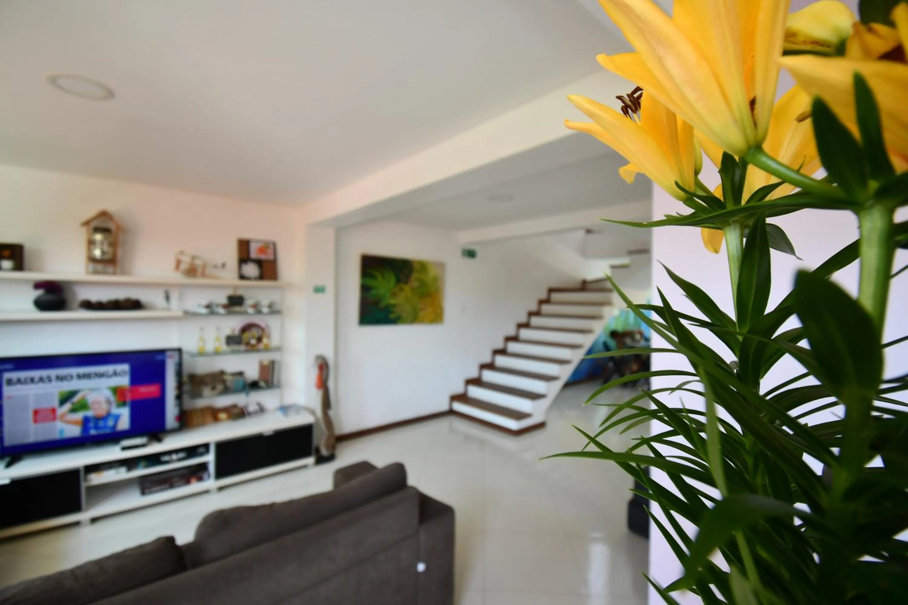 Communal lounge/ TV room in Enseada Hostel