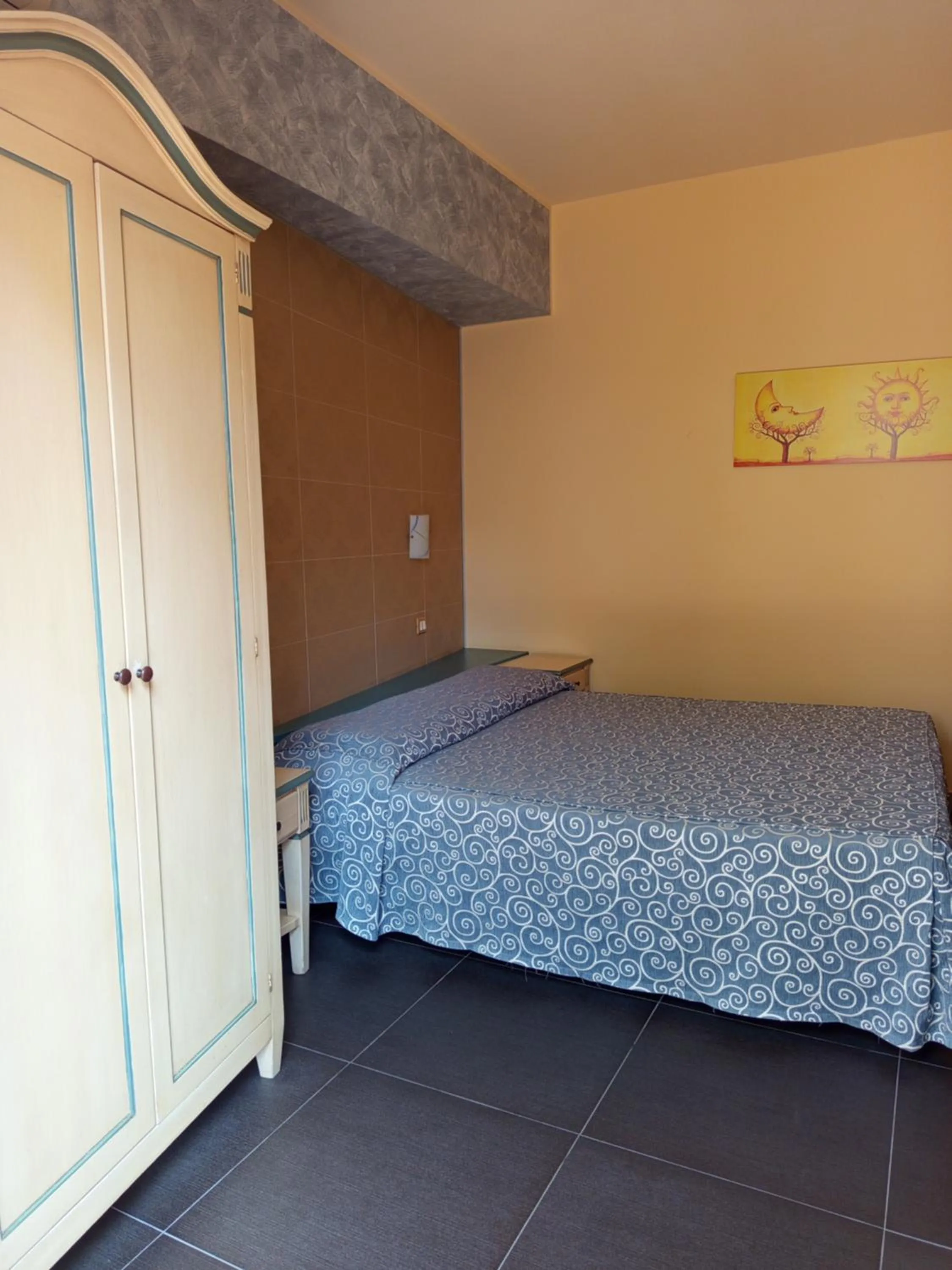 Bedroom in Amaryllis Hotel