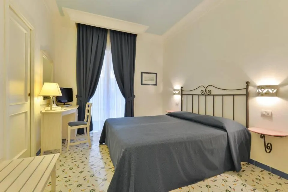 Bed in La Pineta Hotel Beach & Spa