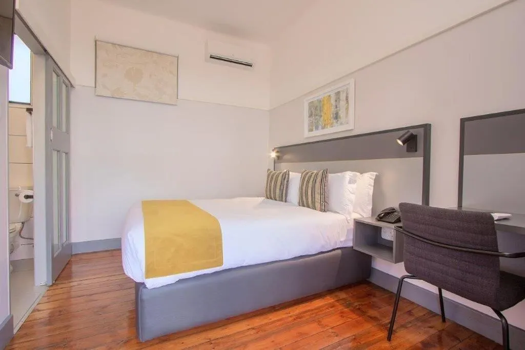 Photo of the whole room, Bed in THE Pretoria Hotel