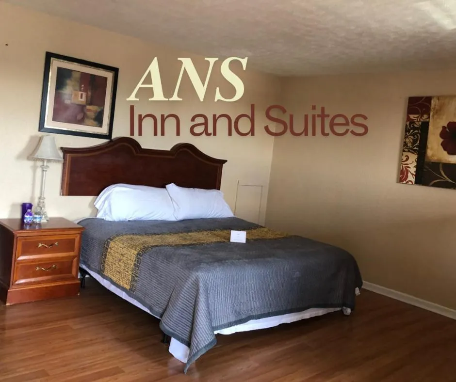 Bed in ANS INN & SUITES