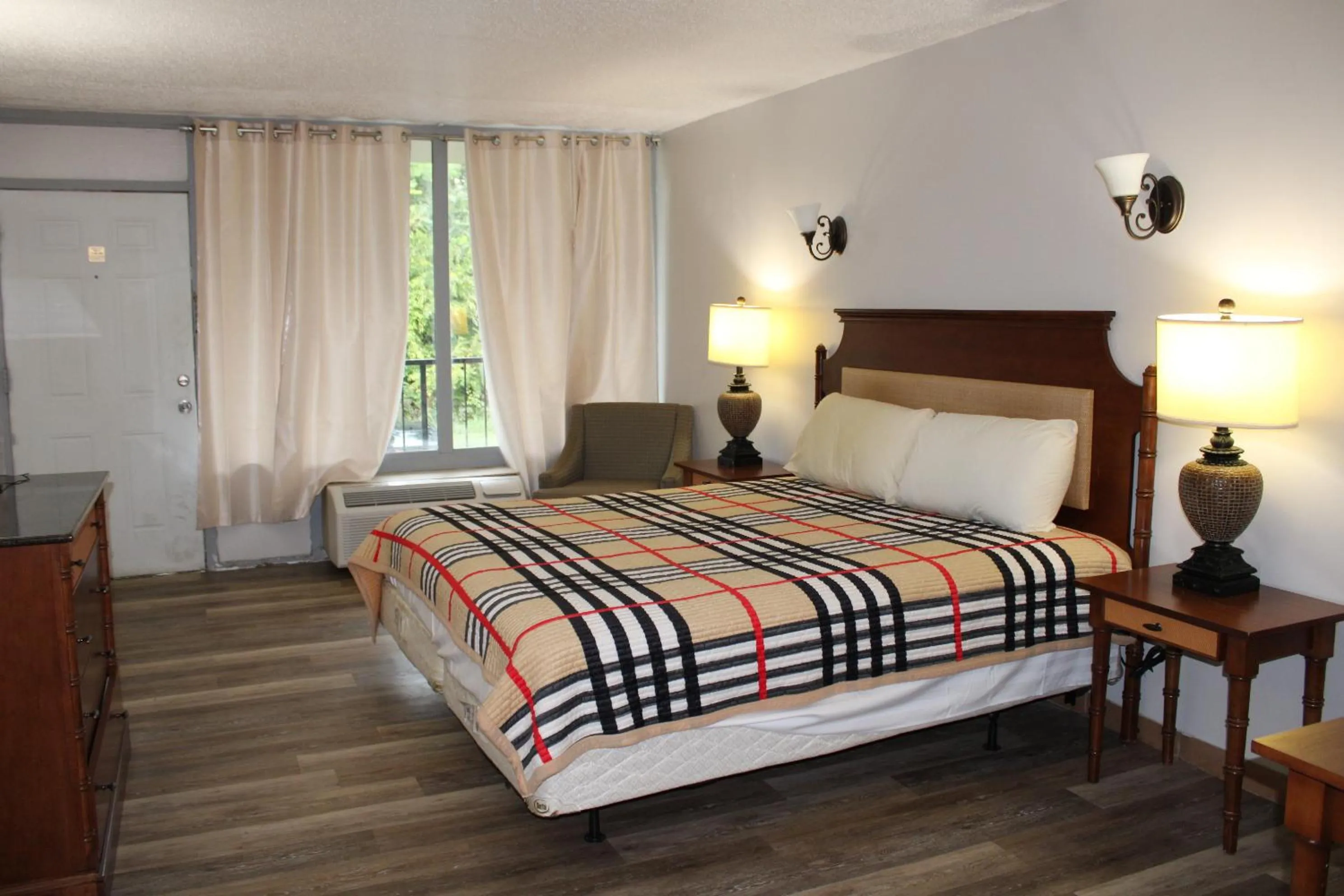 Bed in ANS INN & SUITES