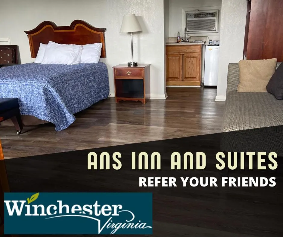 Bed in ANS INN & SUITES