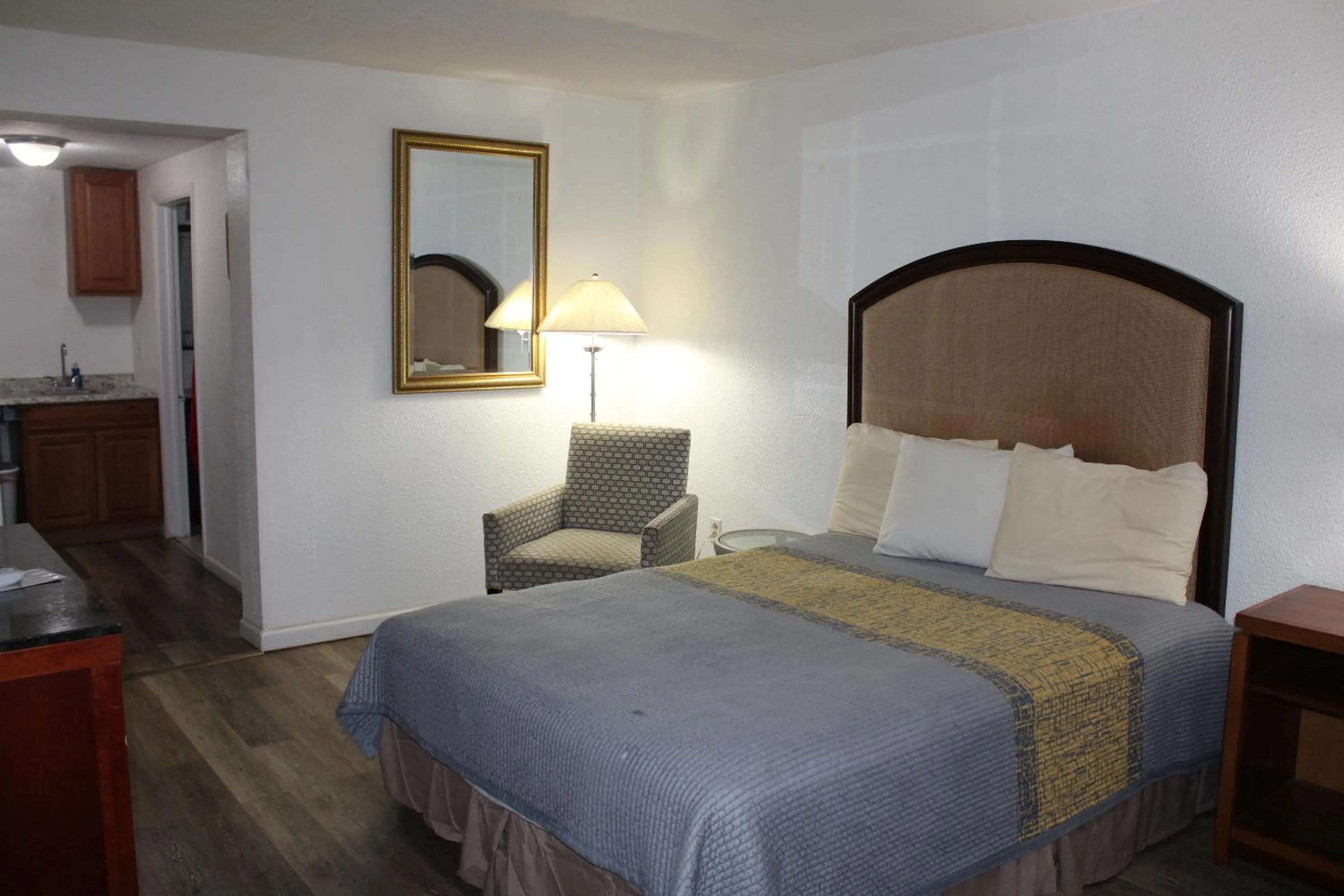 Bed in ANS INN & SUITES