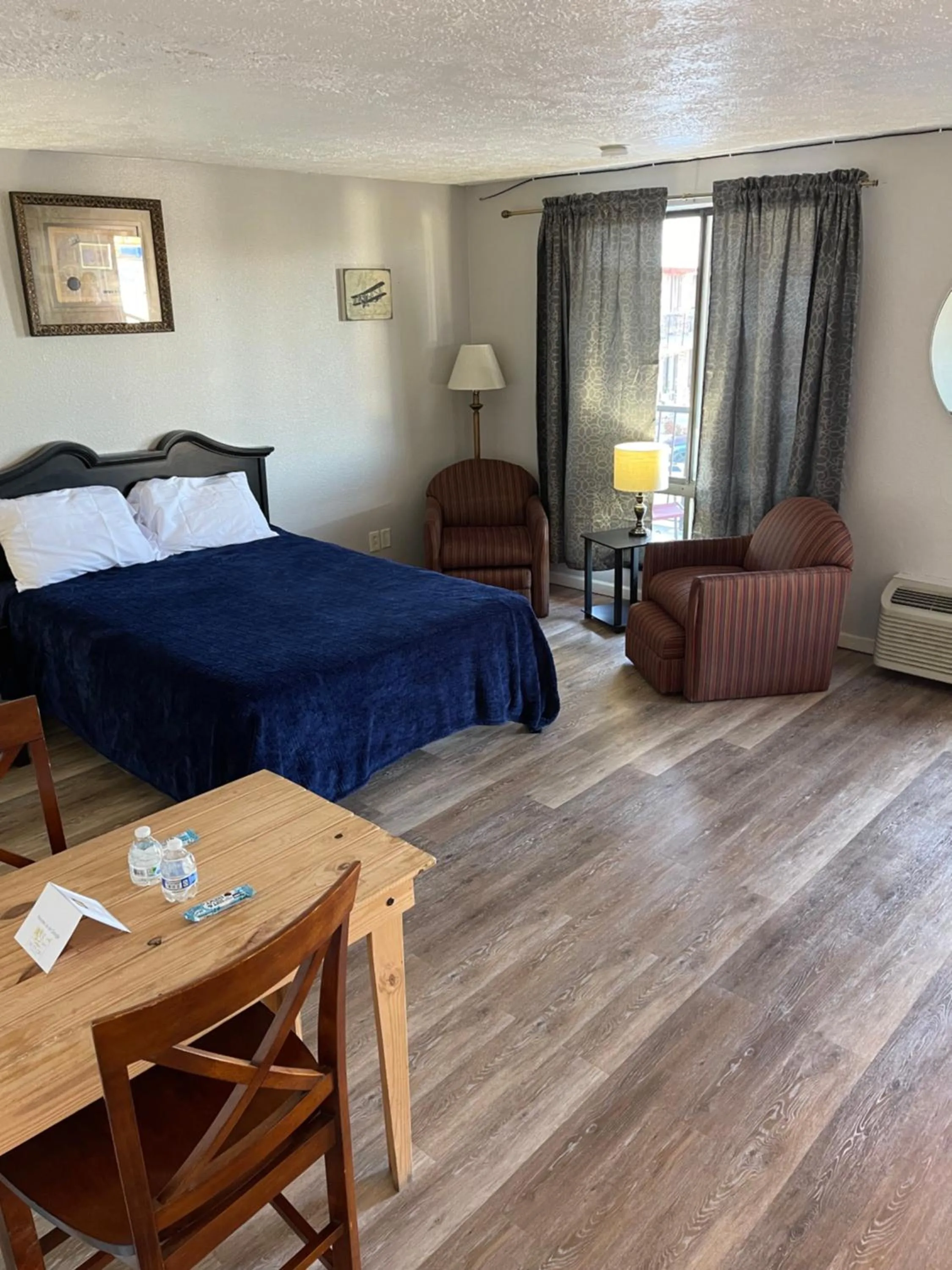 Bed in ANS INN & SUITES