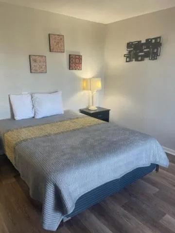 Bed in ANS INN & SUITES