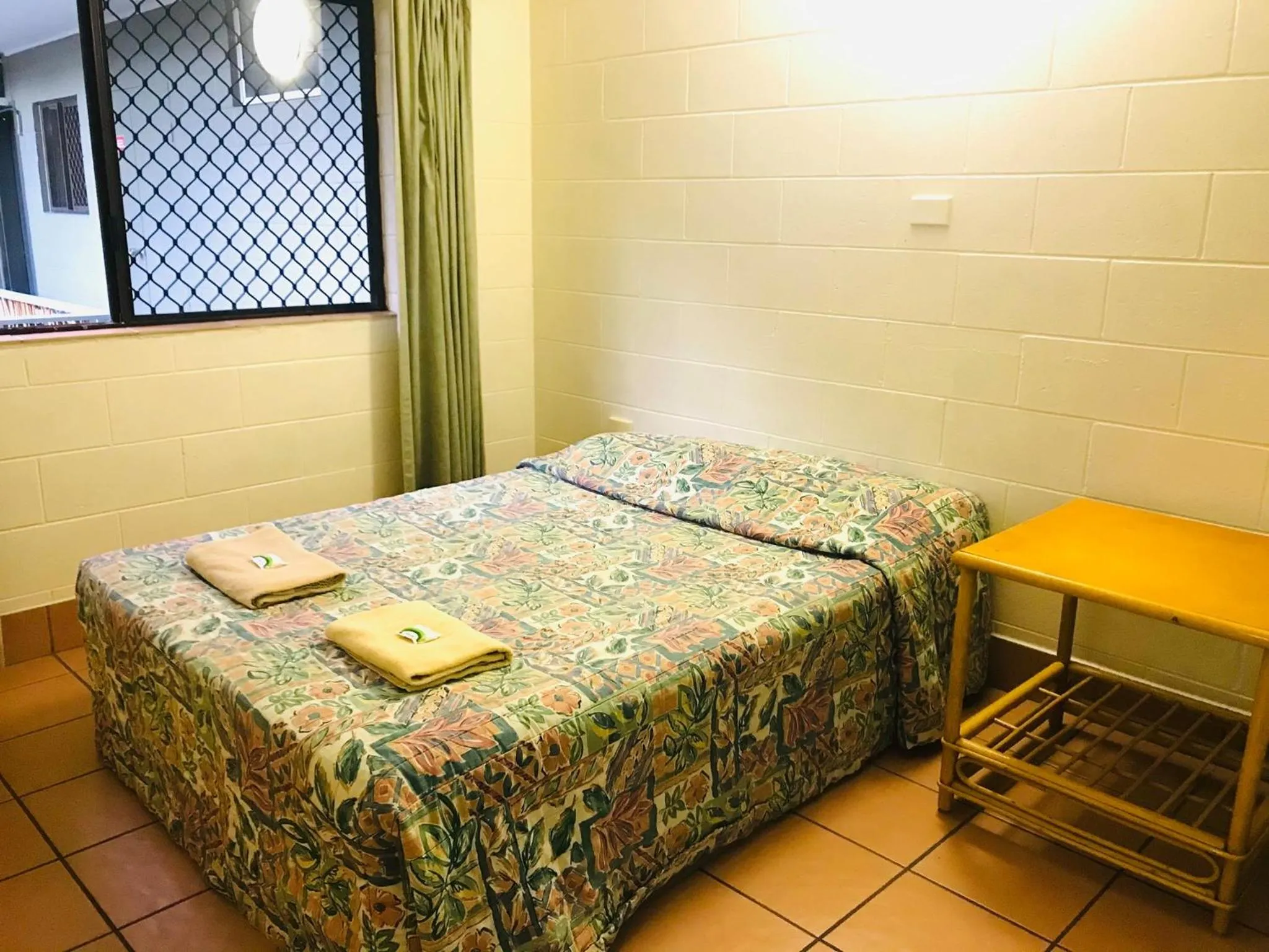 Bed in Koala Beach Resort Cairns