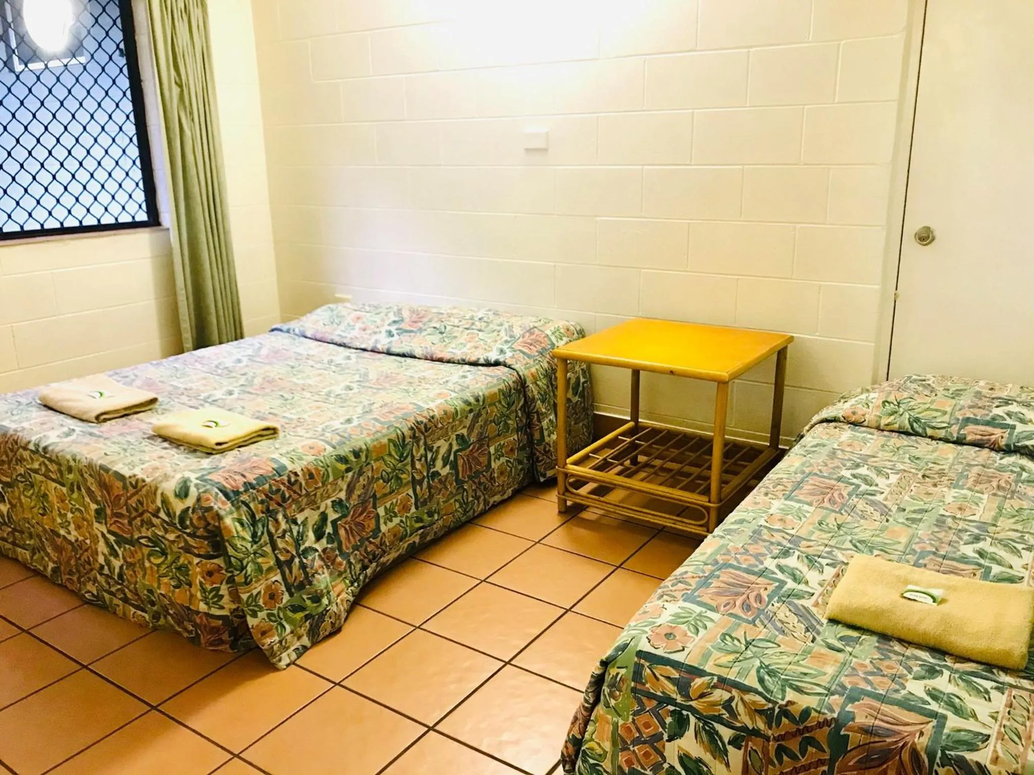 Bed in Koala Beach Resort Cairns