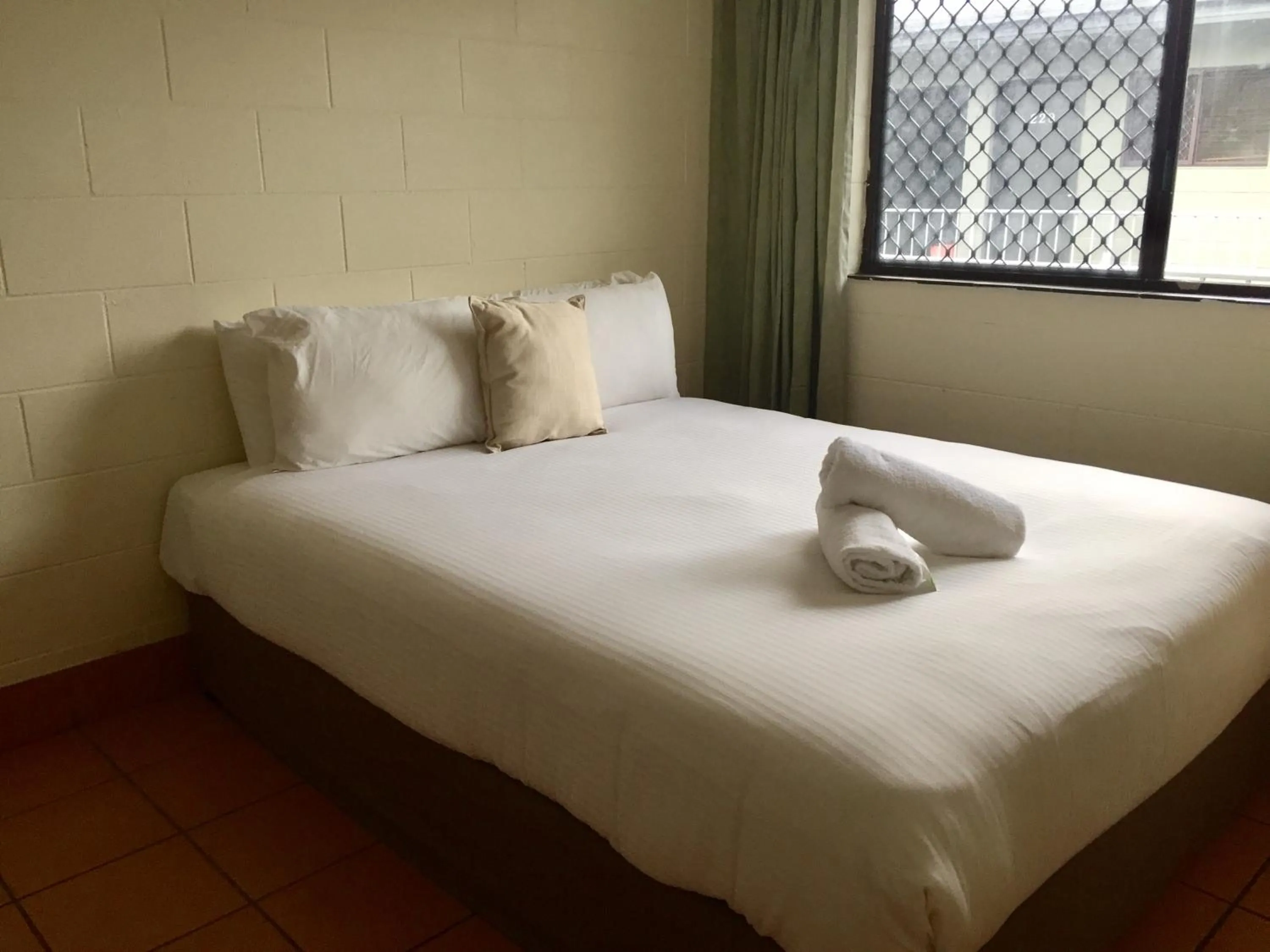 Bed in Koala Beach Resort Cairns