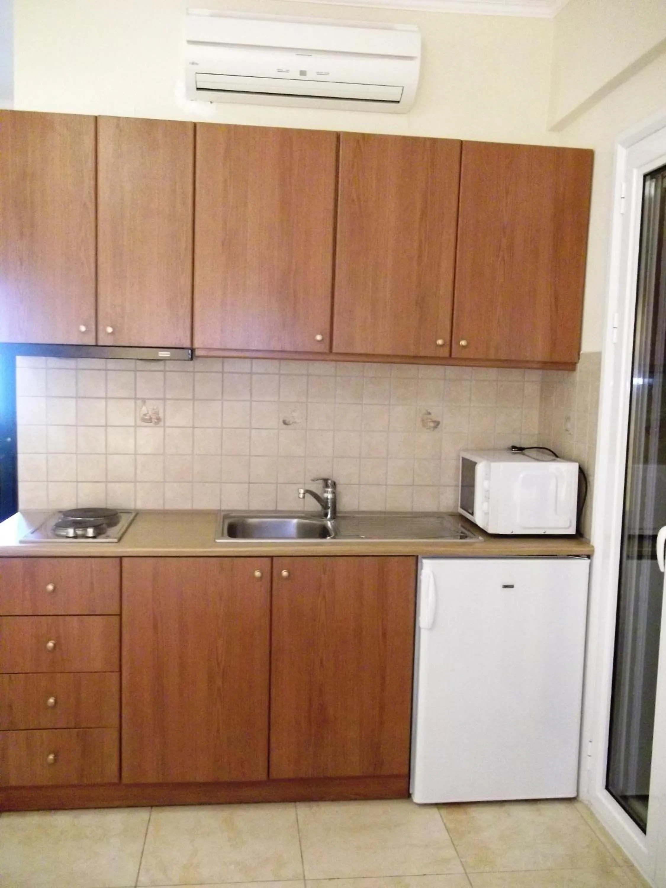 Kitchen or kitchenette in Calypso Luxury Studios