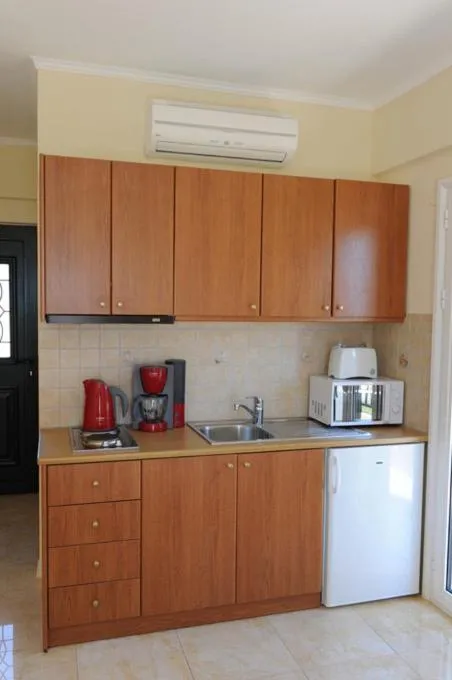Kitchen or kitchenette in Calypso Luxury Studios