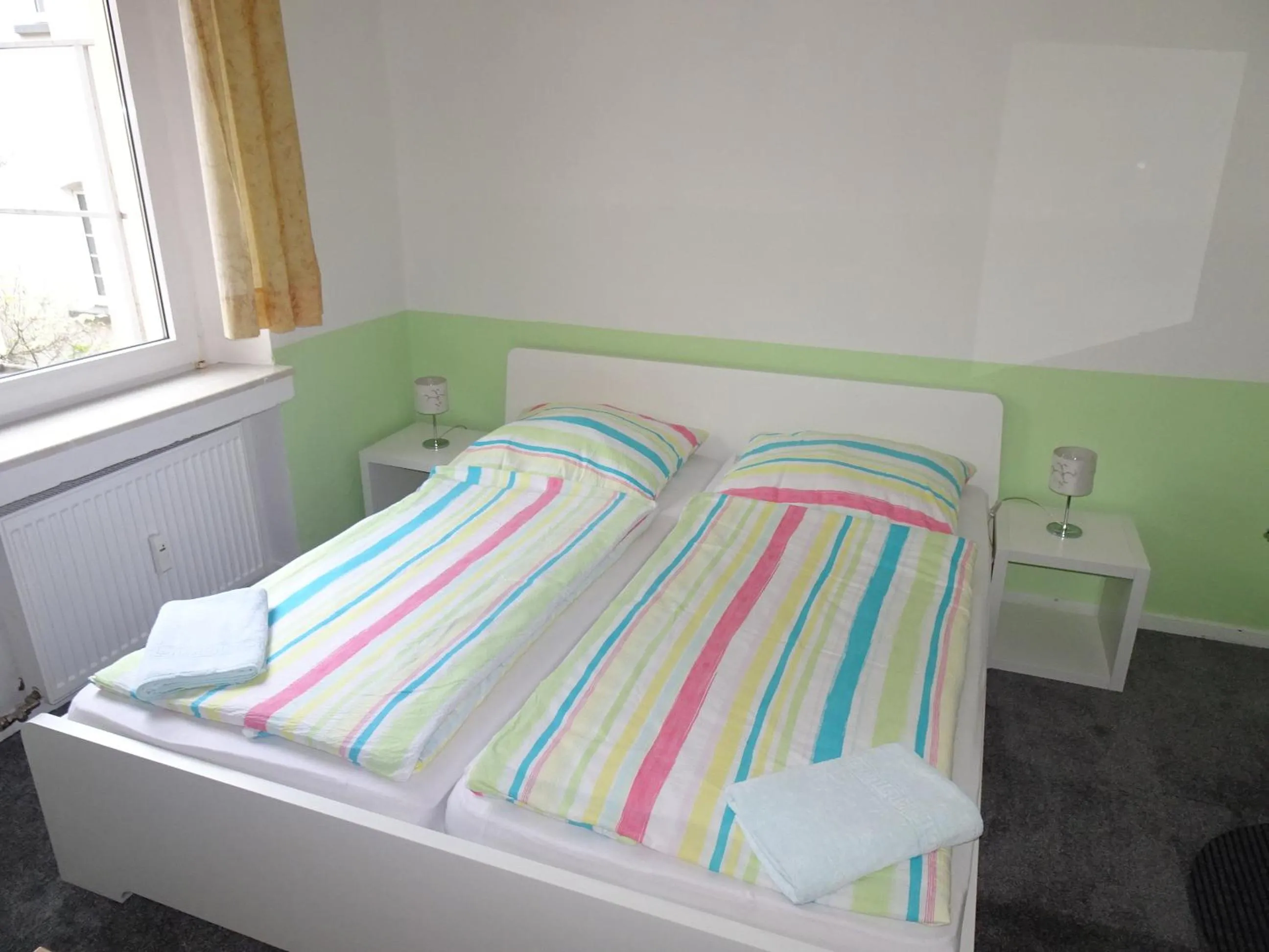 Bed in Gästehaus Grupello