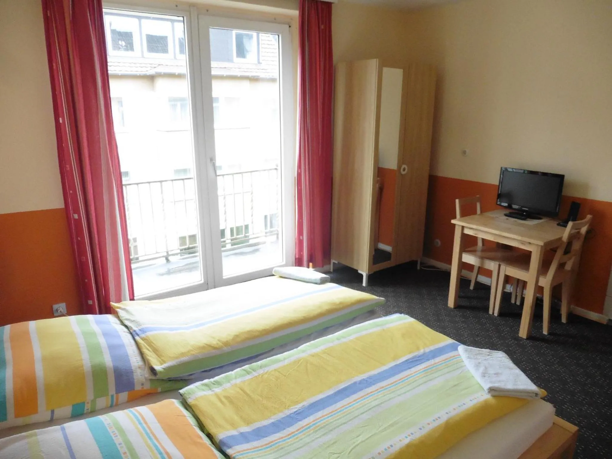 Photo of the whole room, Bed in Gästehaus Grupello