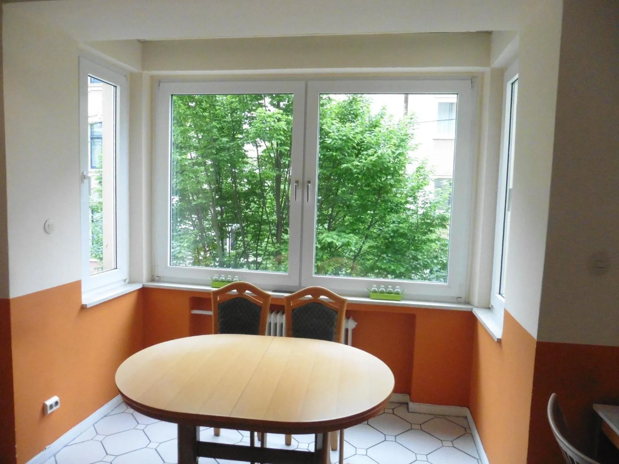 Communal lounge/ TV room in Gästehaus Grupello