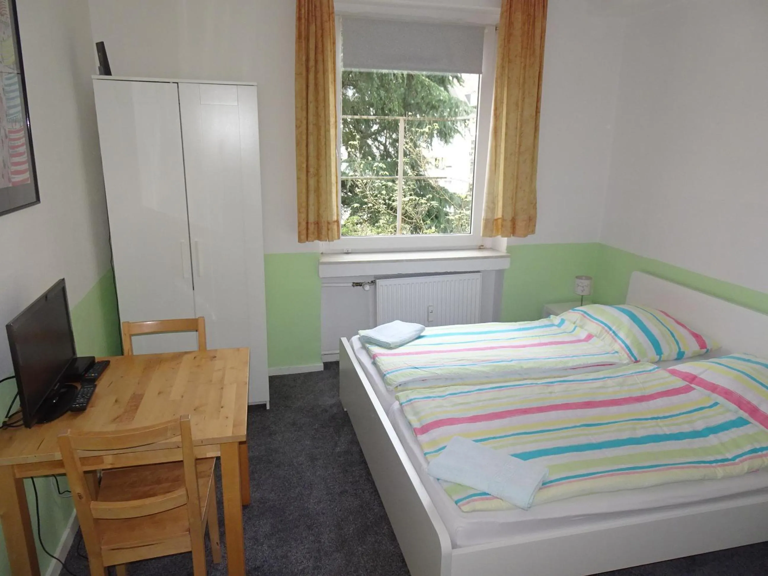Bed in Gästehaus Grupello