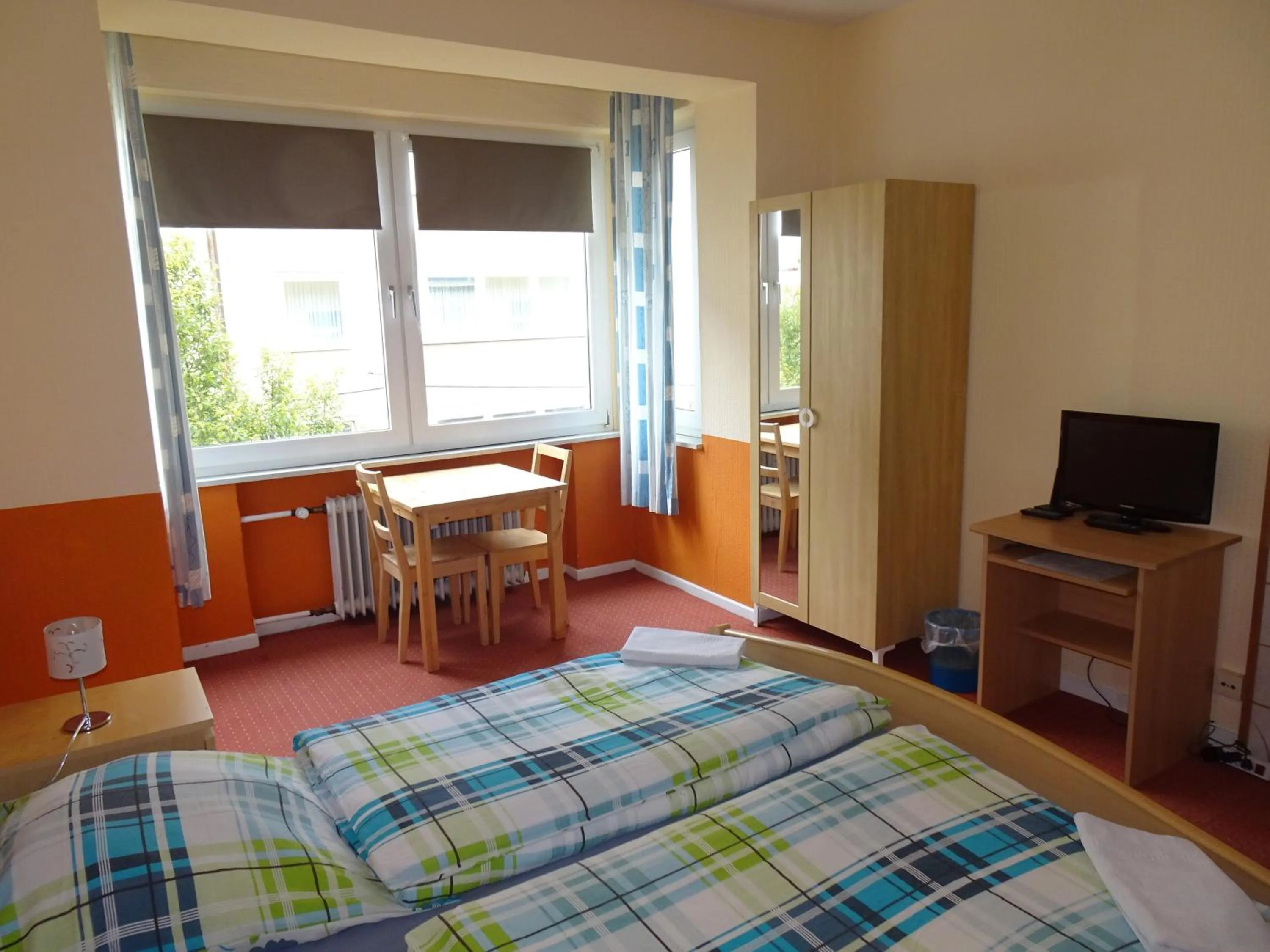 Photo of the whole room, Bed in Gästehaus Grupello