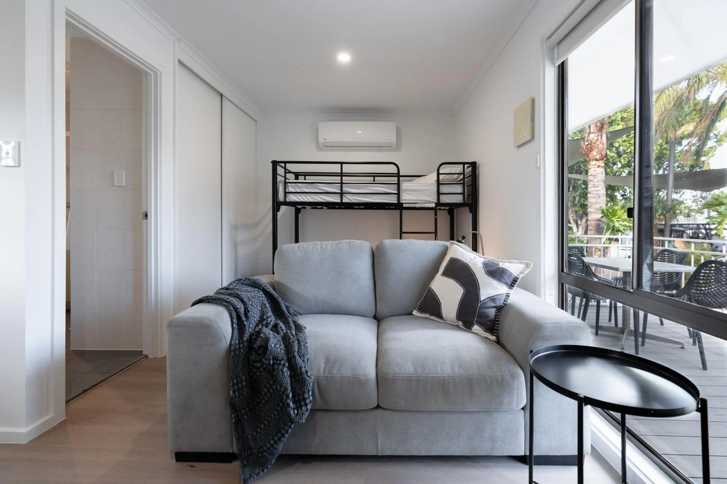 Living room, Bed in Highway 1 Holiday & Lifestyle Park