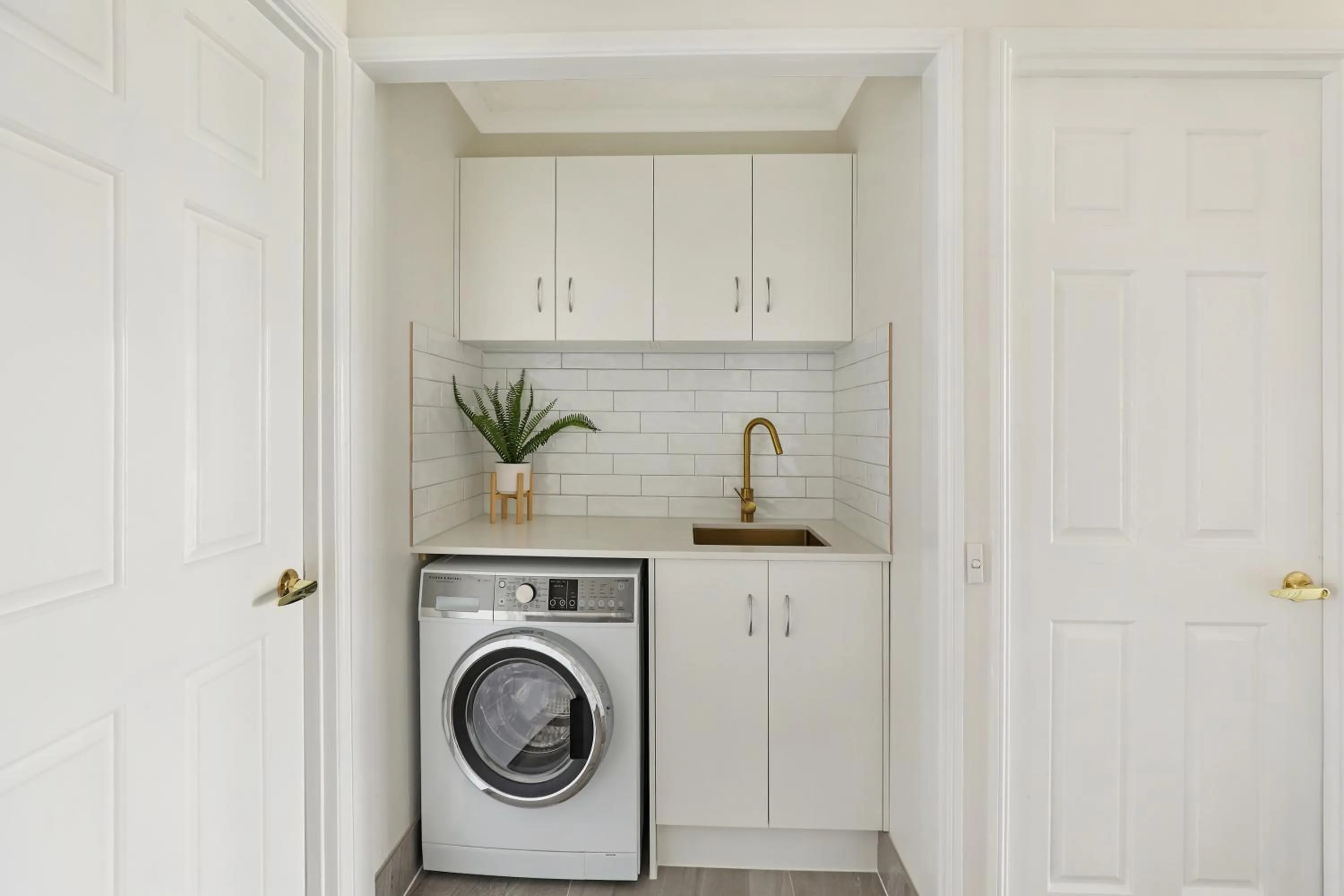 washing machine in Dockside Apartments Mooloolaba