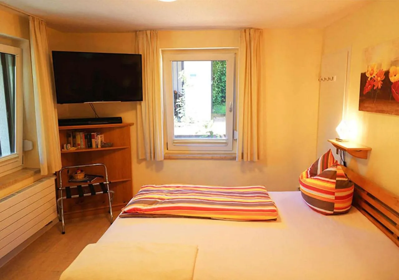 Communal lounge/ TV room, Bed in Hotel Haus Orchideental Jena