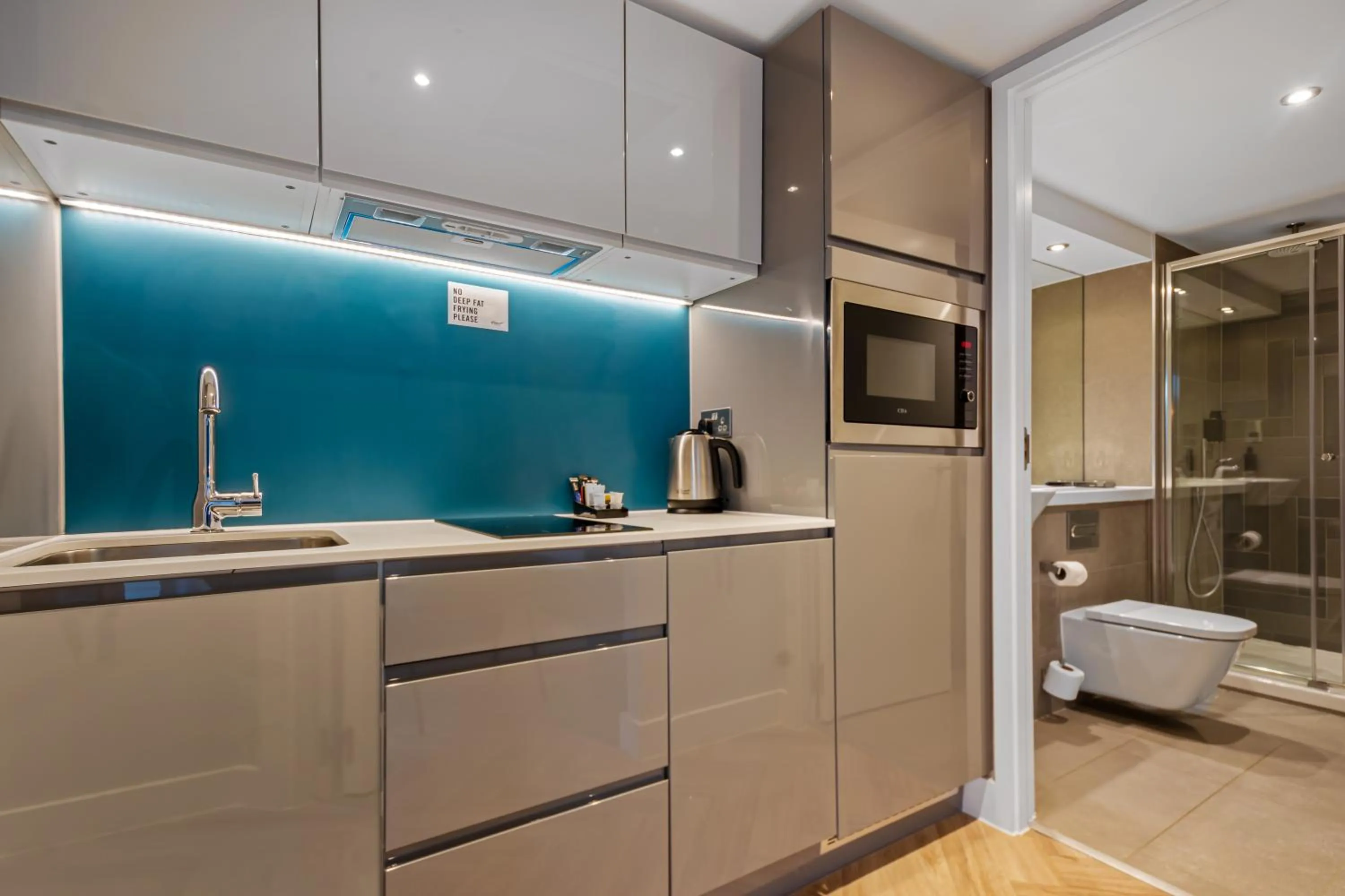 Kitchen or kitchenette in Roomzzz Newcastle City
