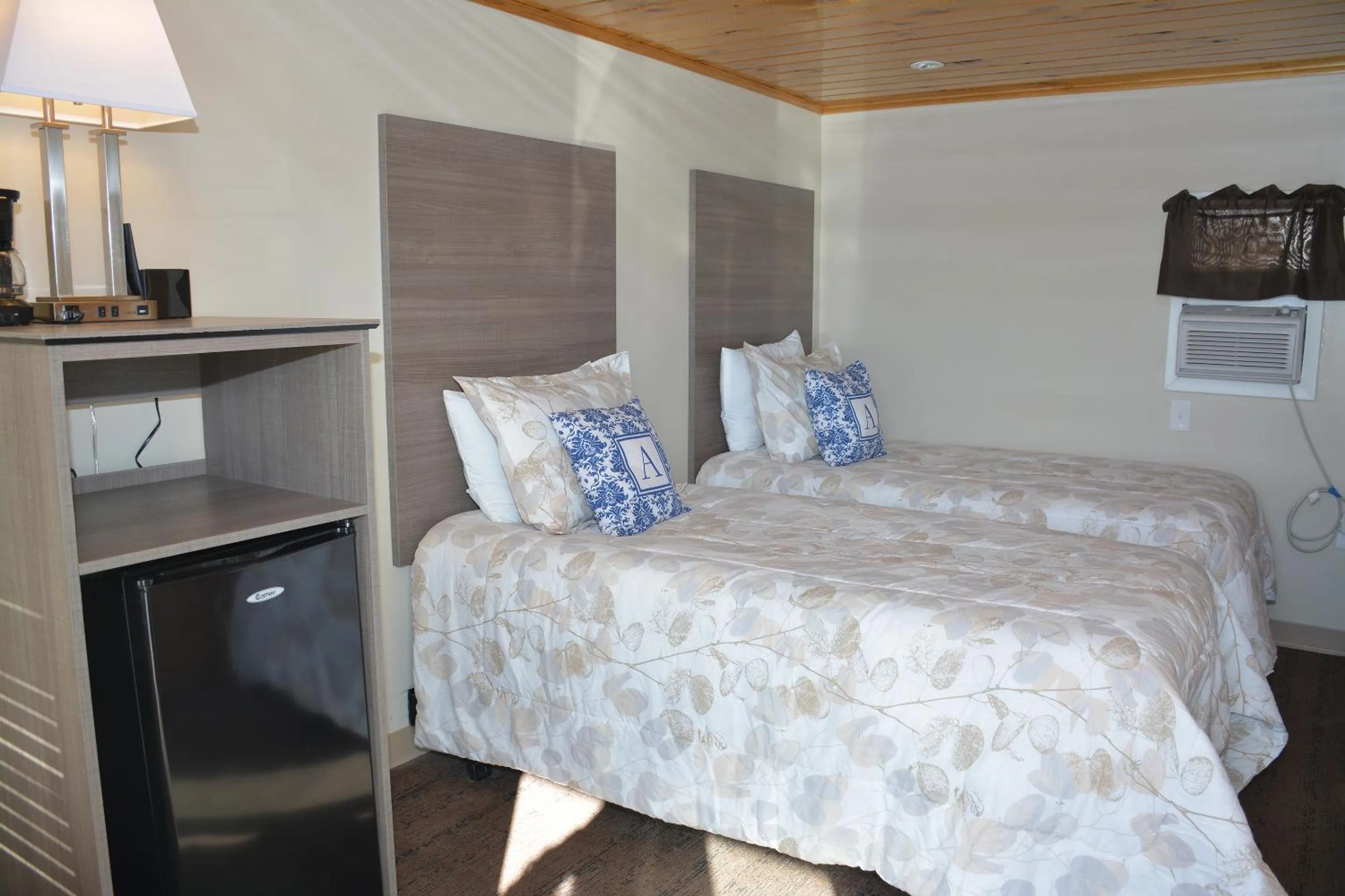 Bed in Alouette Beach Resort Economy Rooms