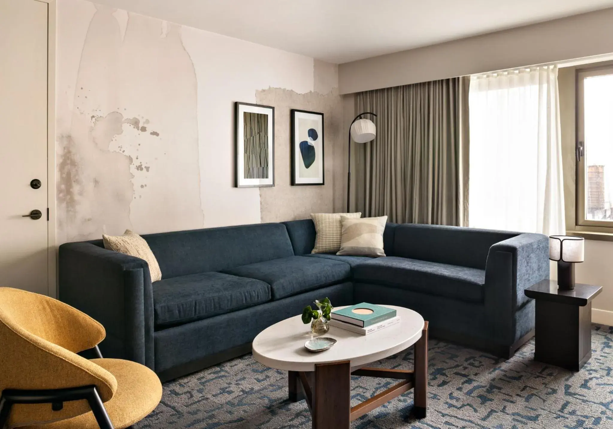 Living room in Kimpton Theta New York - Times Square by IHG Living room in Kimpton Theta New York - Times Square by IHG