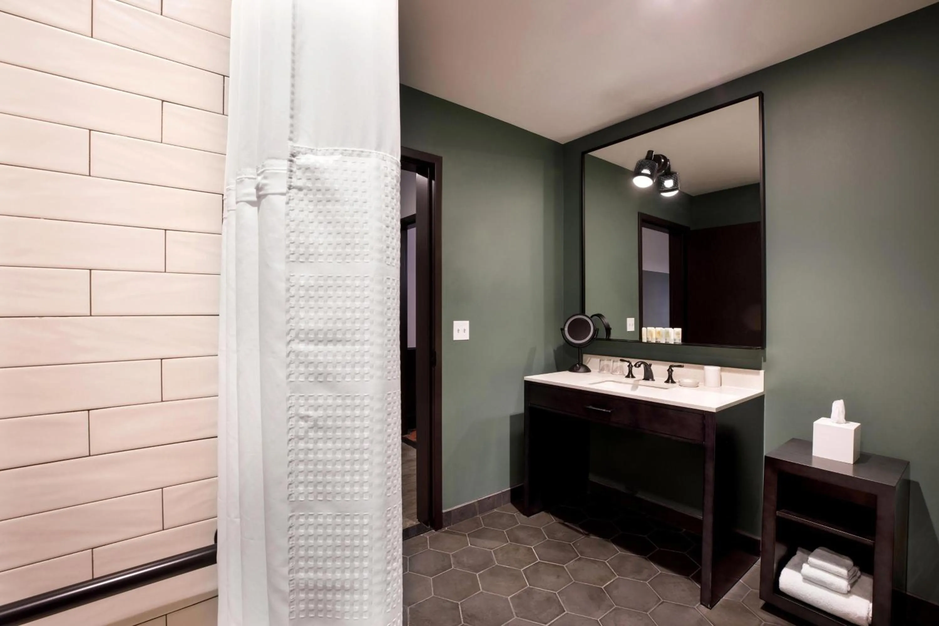 Bathroom in Cyrus Hotel, Topeka, a Tribute Portfolio Hotel