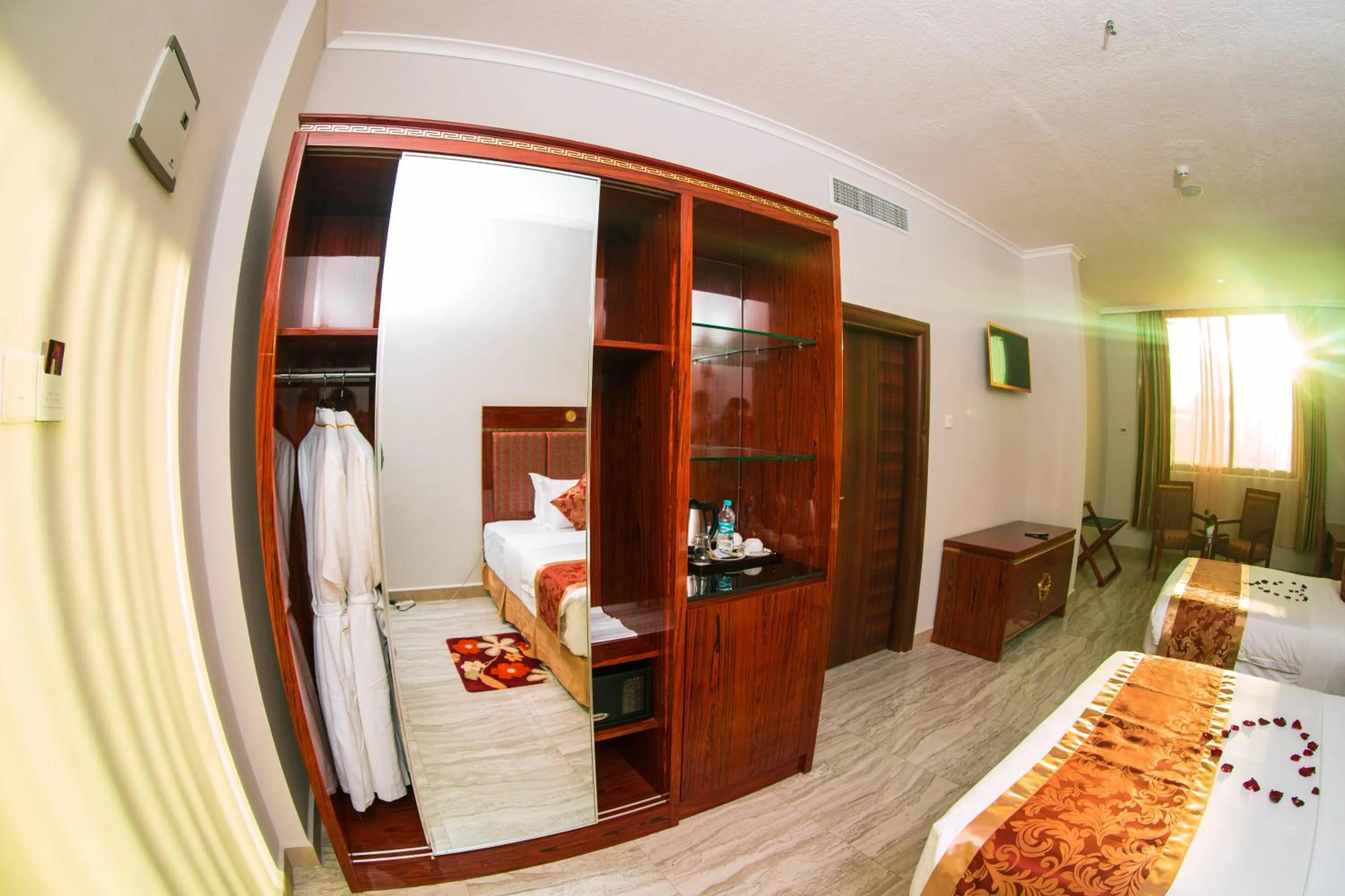 Coffee/tea facilities, Bed in Tiffany Diamond Hotels LTD - Makunganya