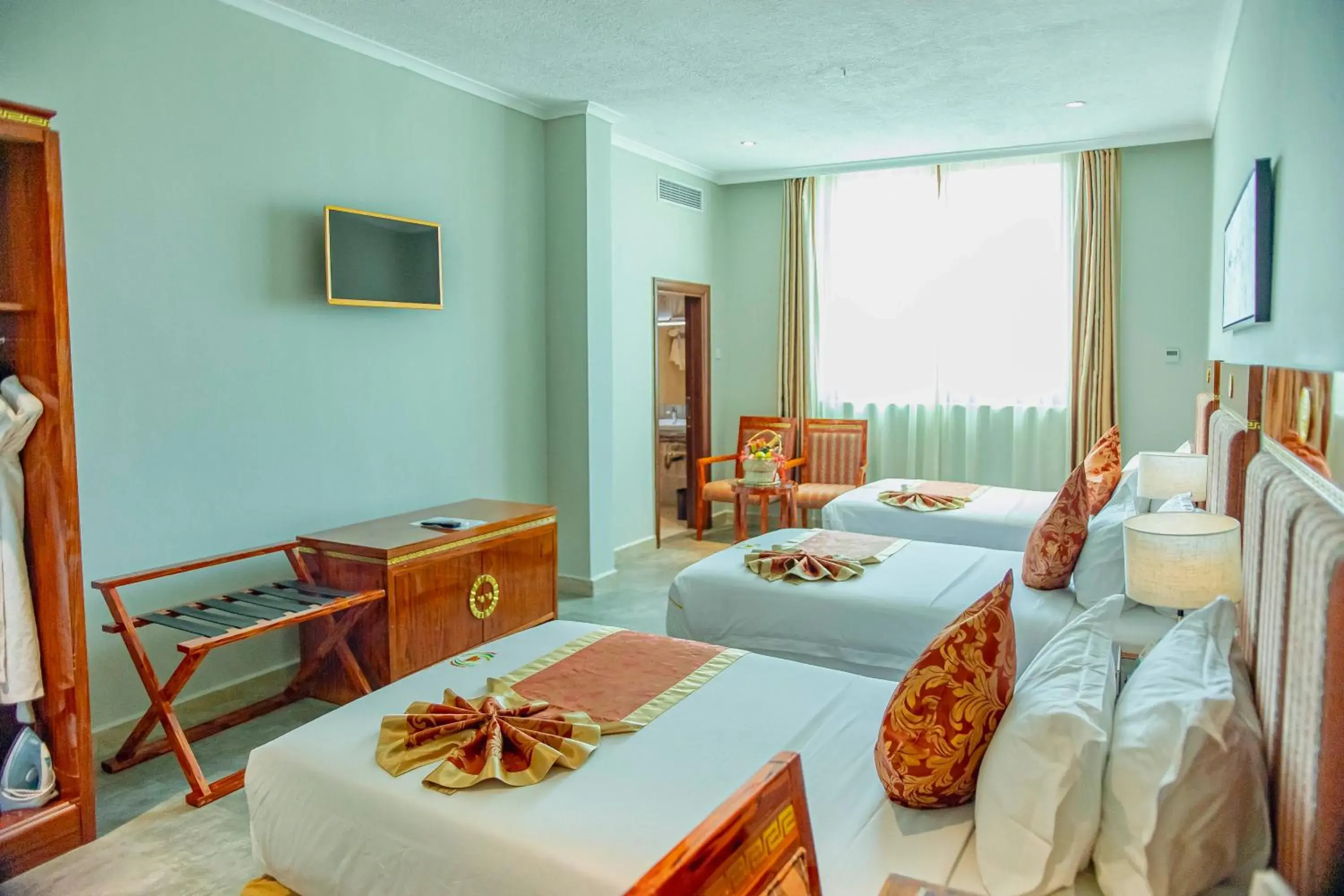 Superior Triple Room in Tiffany Diamond Hotels LTD - Makunganya Superior Triple Room in Tiffany Diamond Hotels LTD - Makunganya