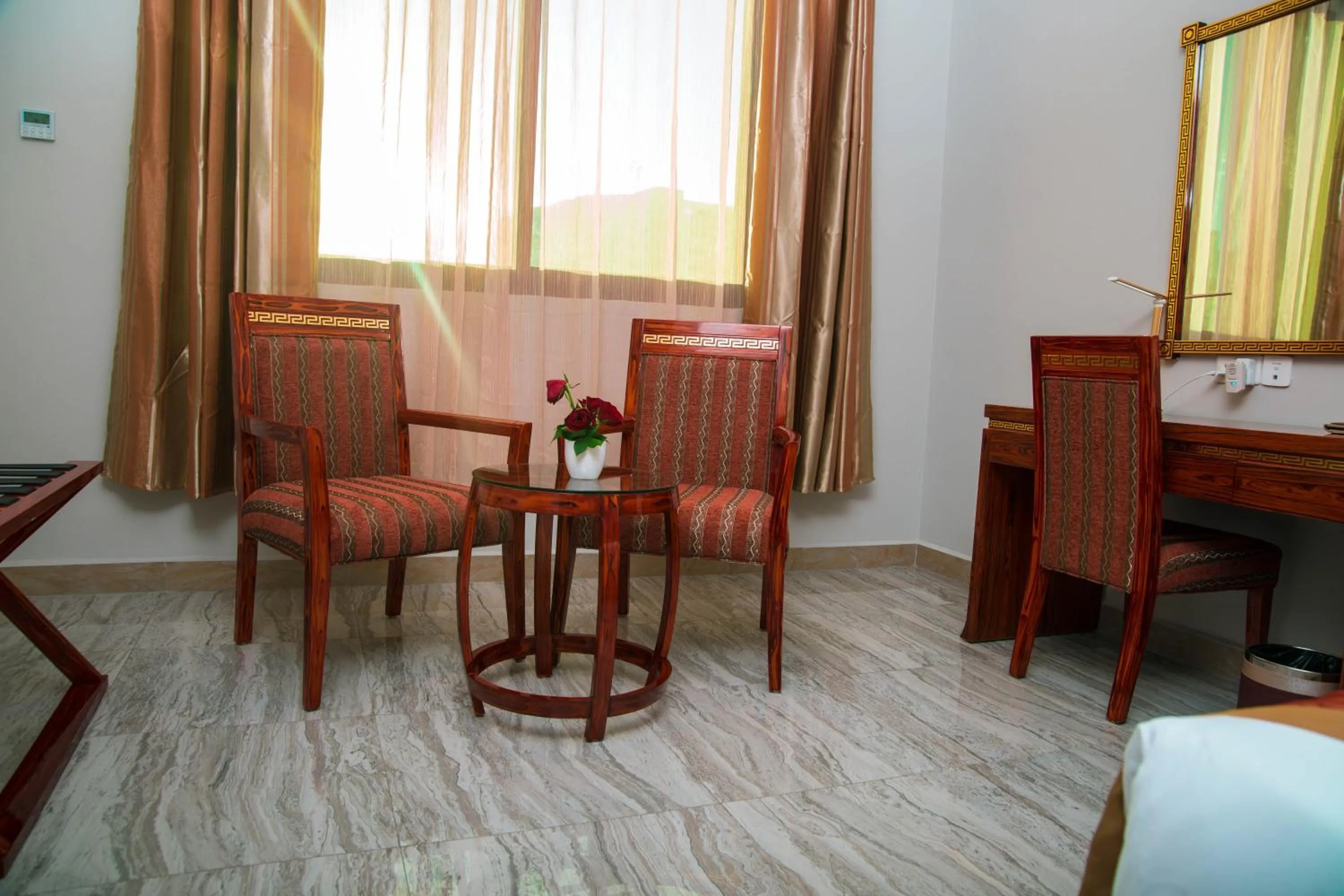 Seating area, Bed in Tiffany Diamond Hotels LTD - Makunganya