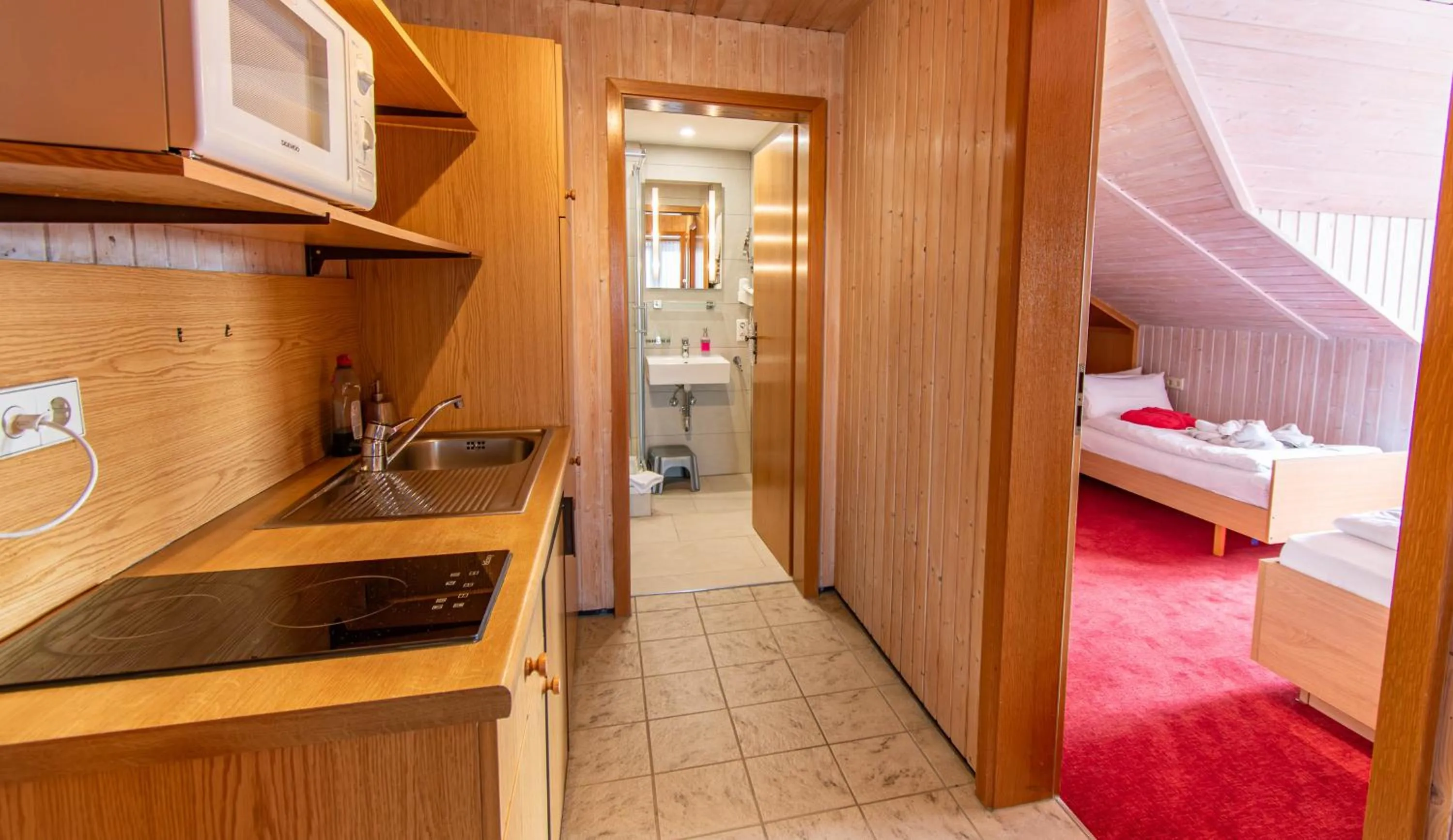 Kitchen or kitchenette, Bed in Wellnesshotel Hohenrodt