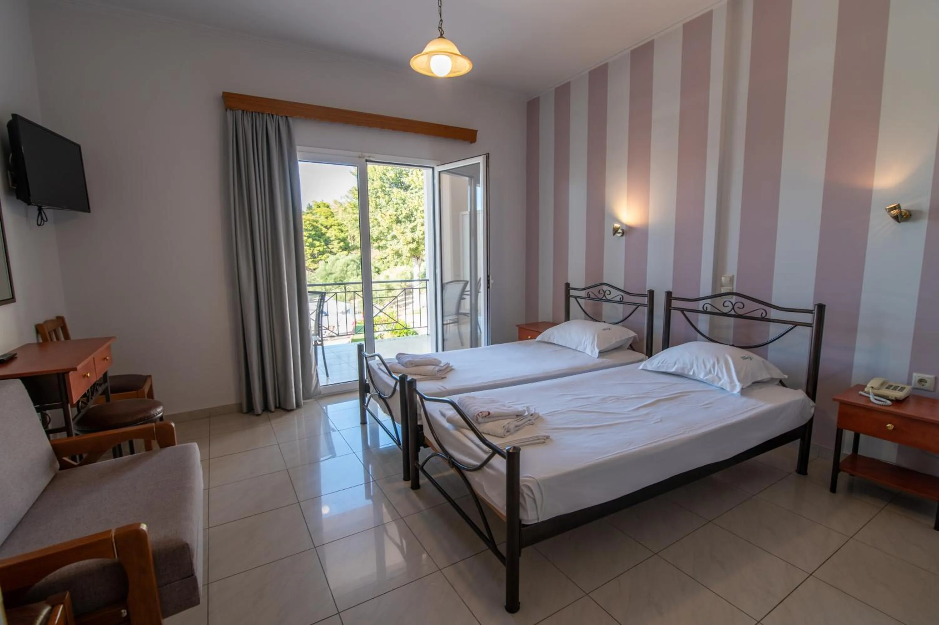 Bed in Elektra Hotel