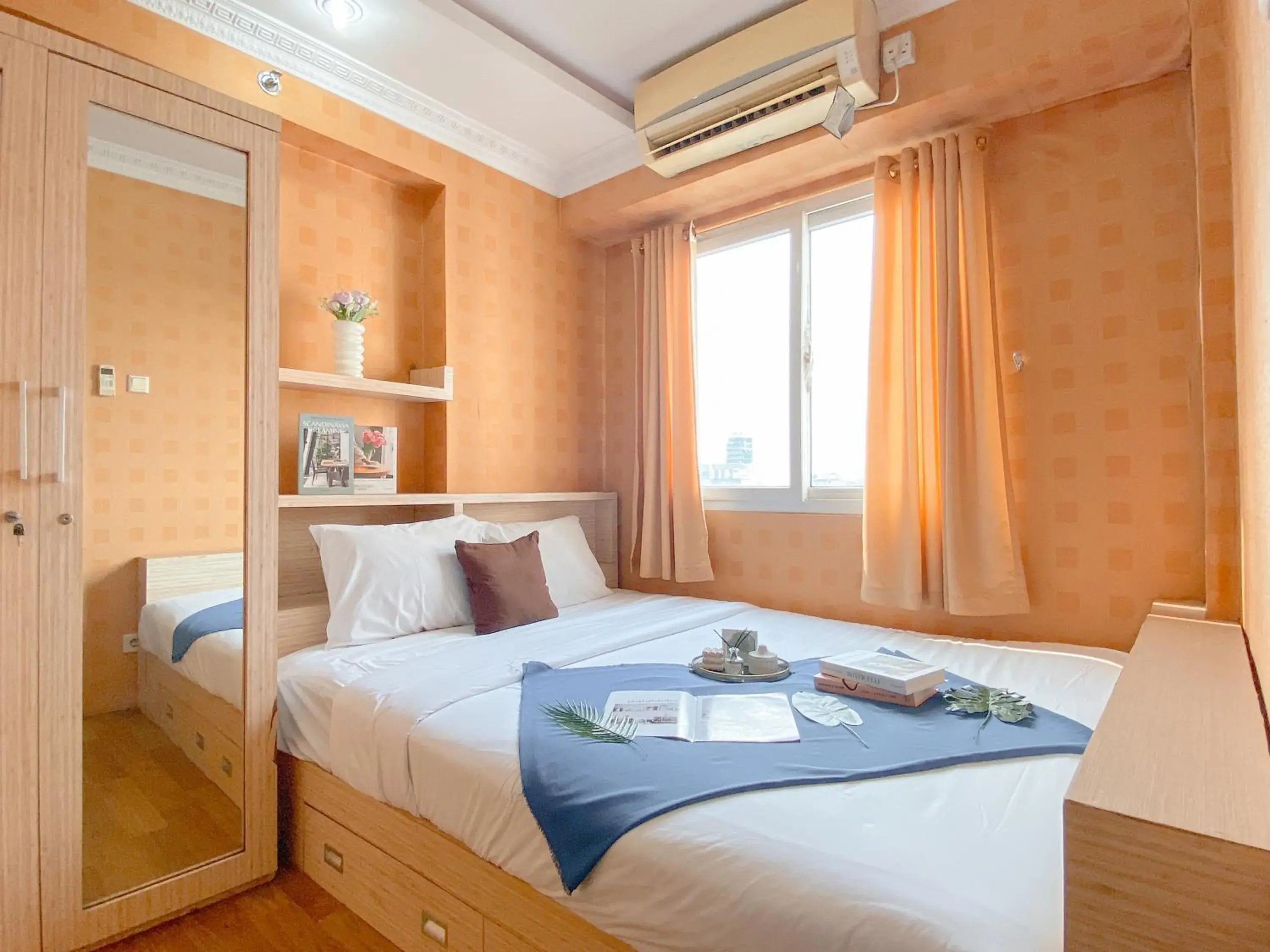 Relaxing 2BR with Pool View Mutiara Bekasi Apartment By Travelio Relaxing 2BR with Pool View Mutiara Bekasi Apartment By Travelio