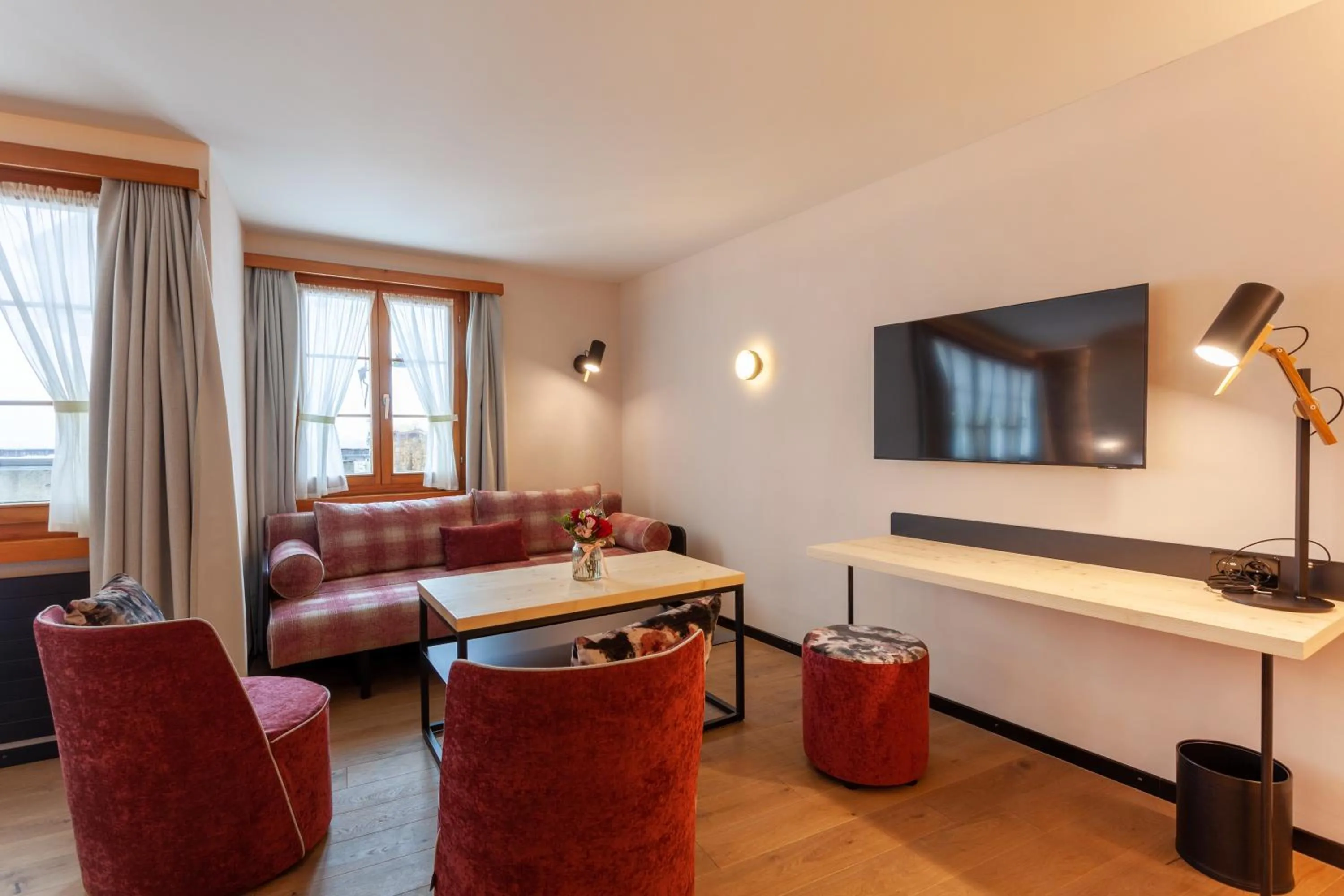 Communal lounge/ TV room in Sonne Andermatt Swiss Quality Hotel