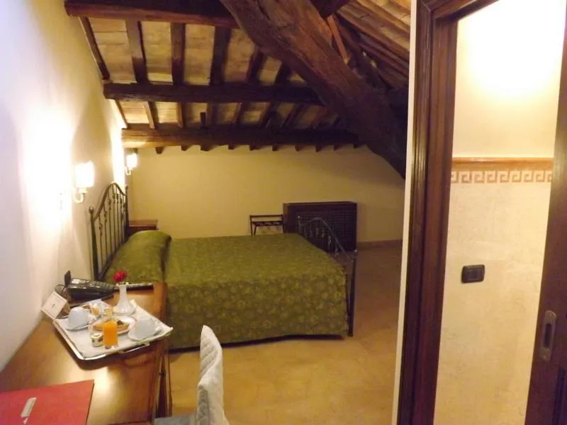 Photo of the whole room in Relais Il Postiglione - Antica Posta dei Chigi