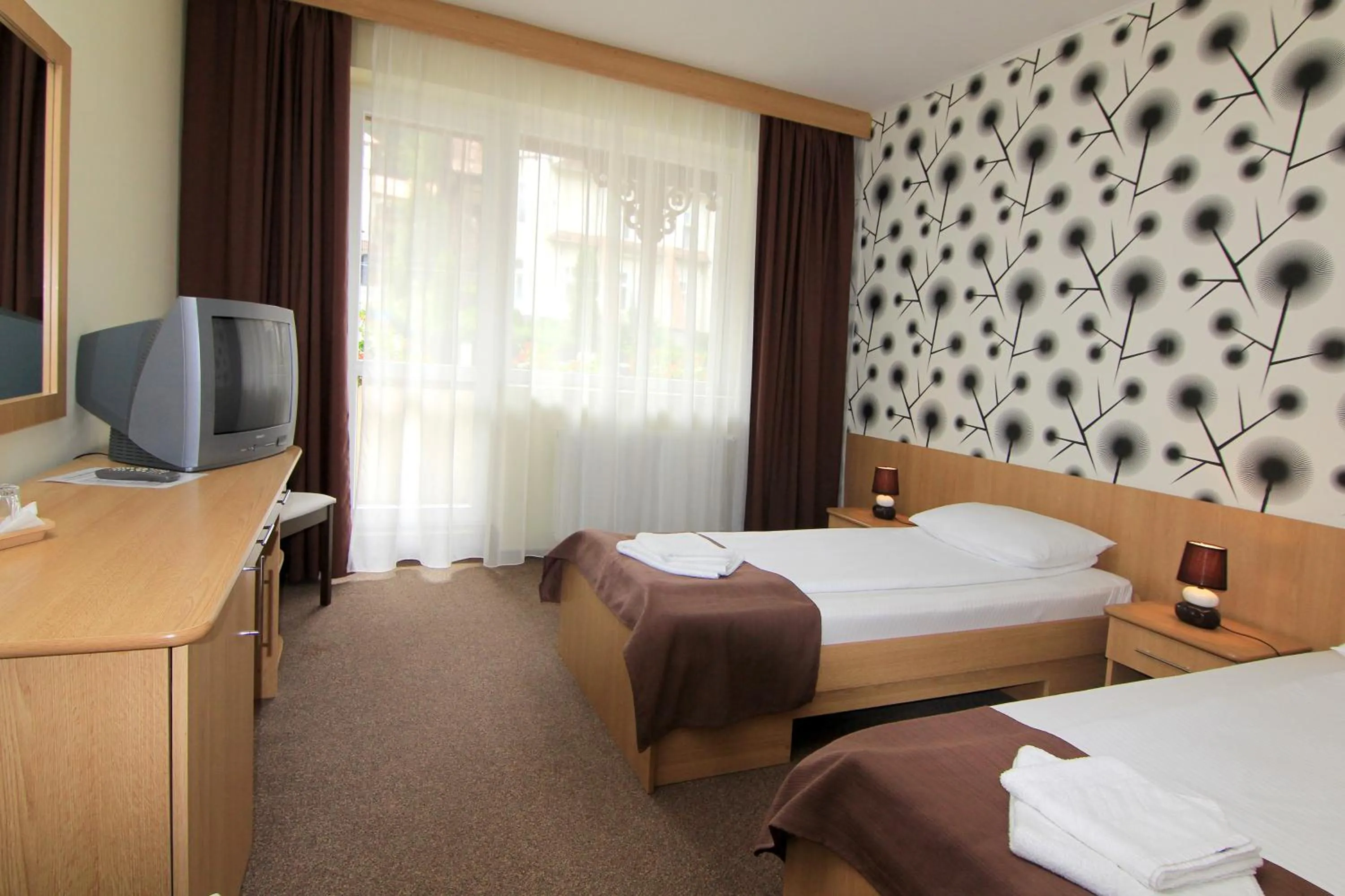 Bed in Hotel Muresul Health Spa