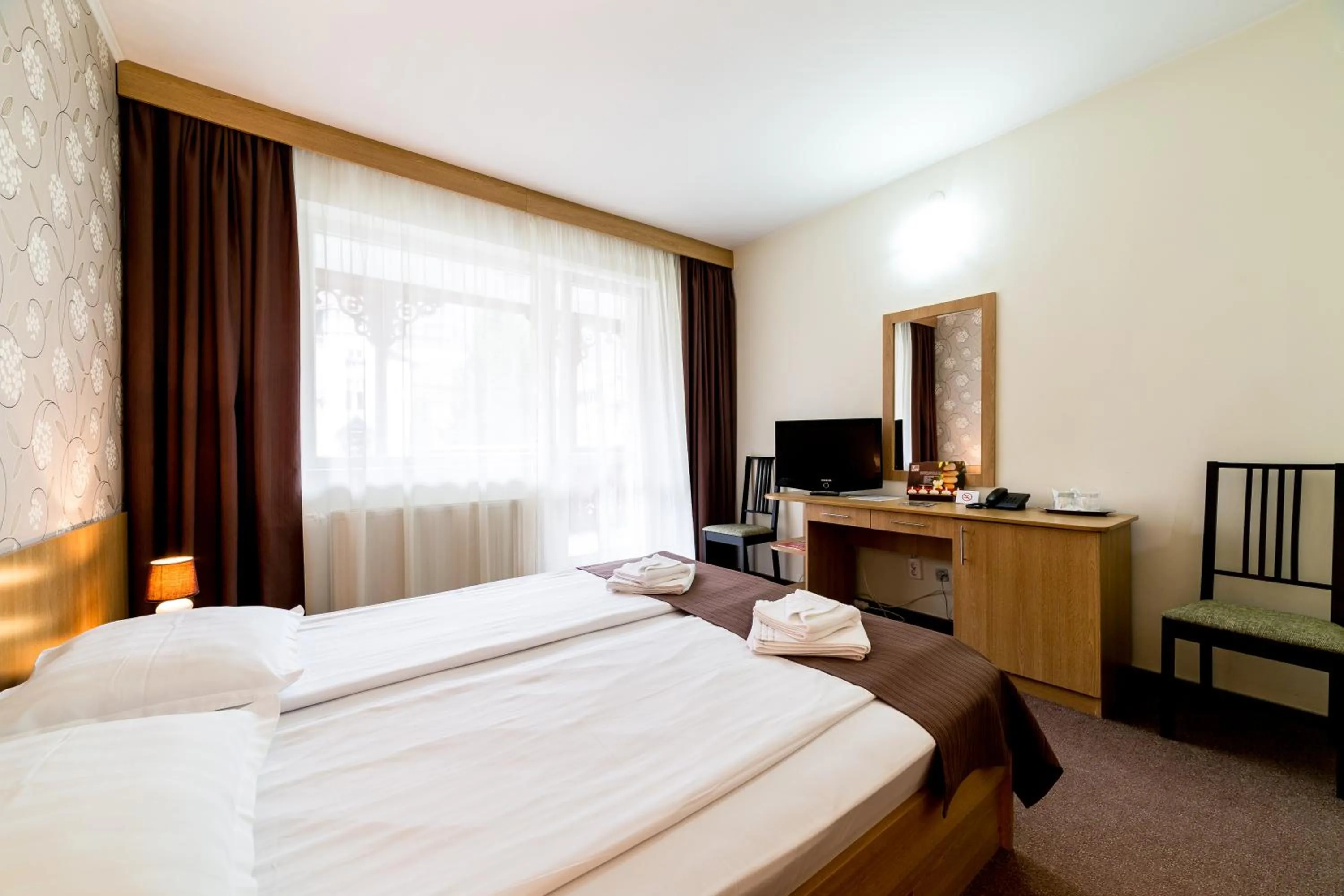 Bed in Hotel Muresul Health Spa