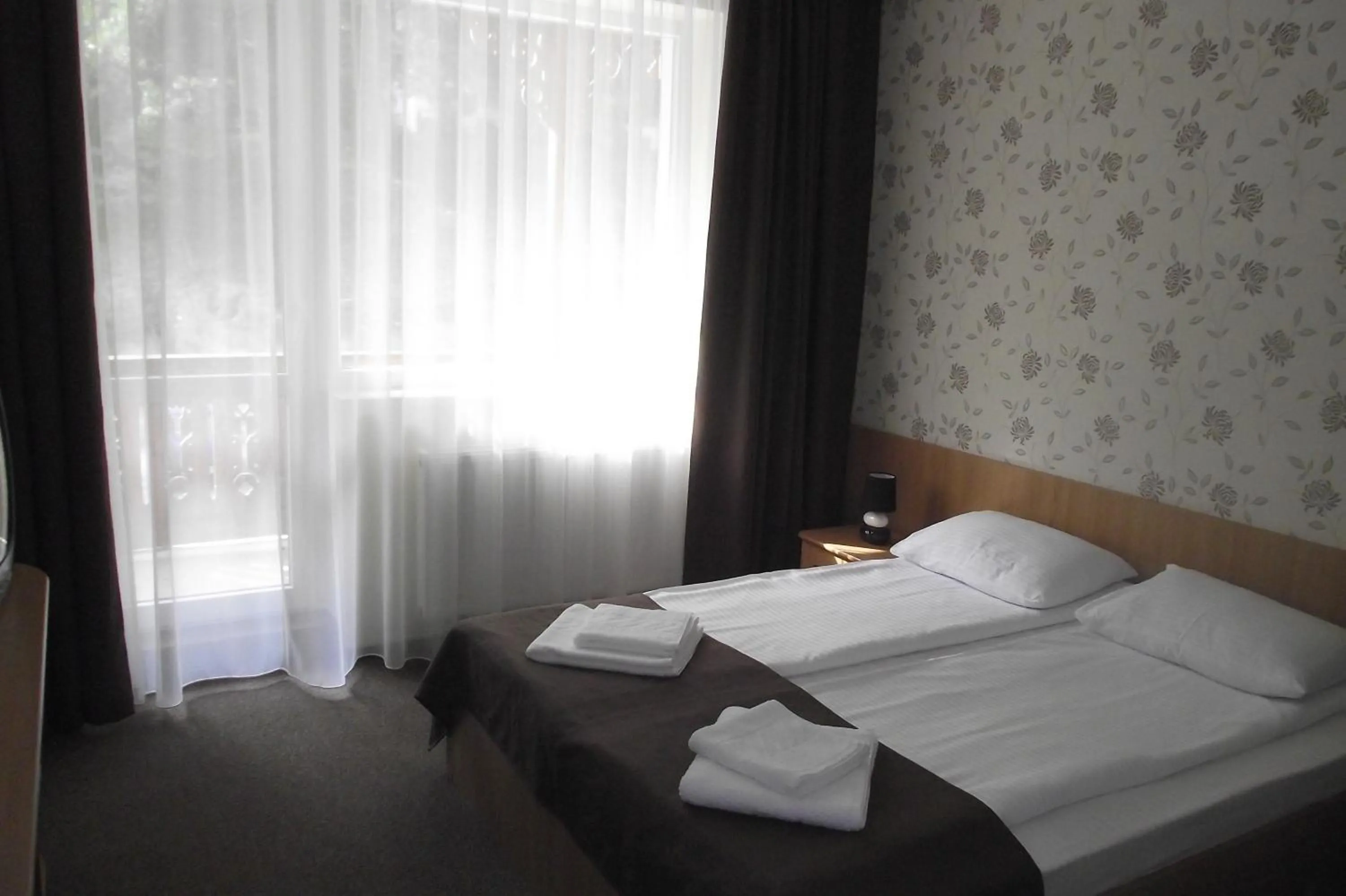 Bed in Hotel Muresul Health Spa