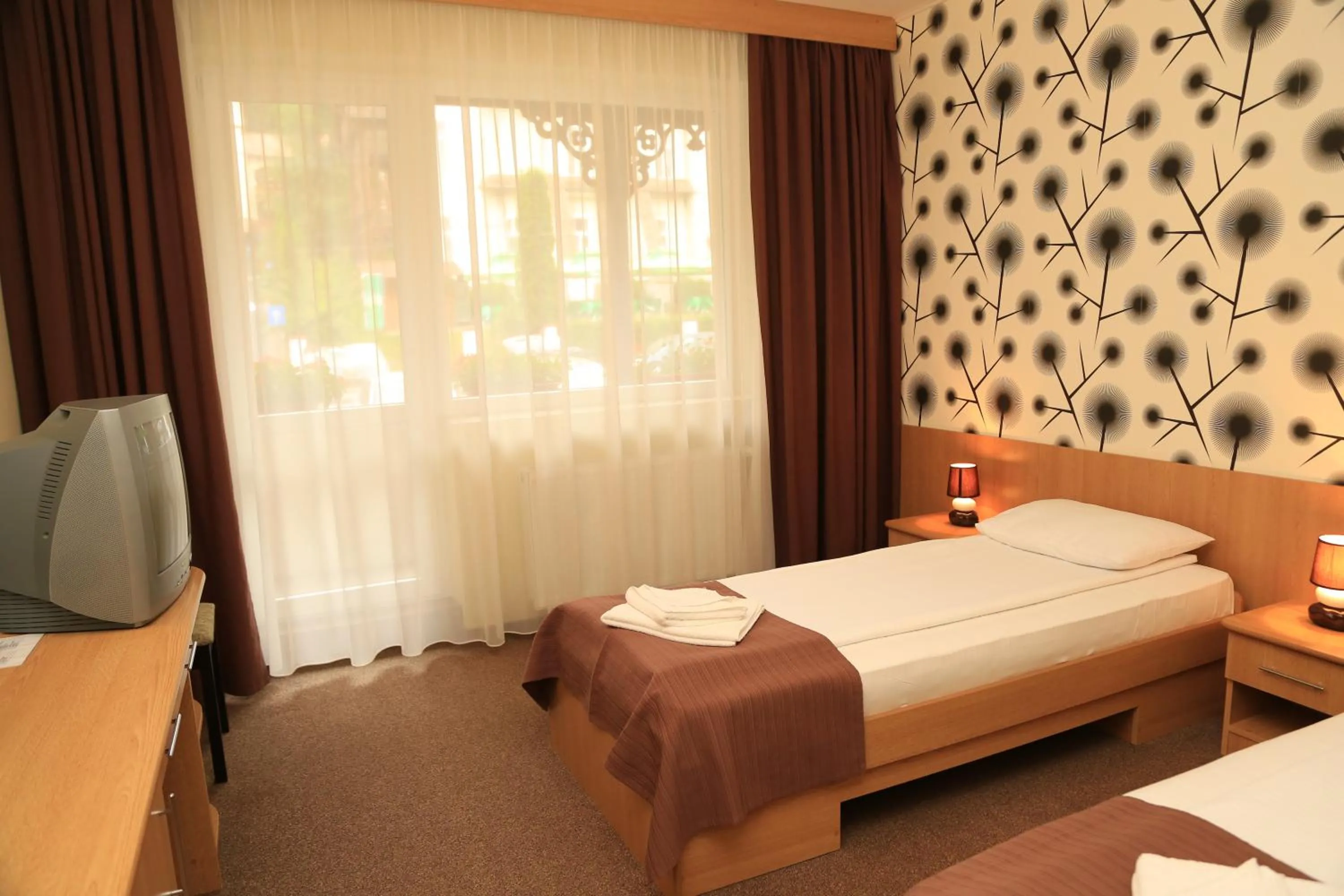Bed in Hotel Muresul Health Spa