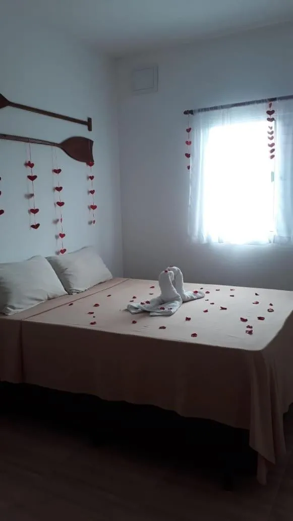 Bed in Pousada Parapuã