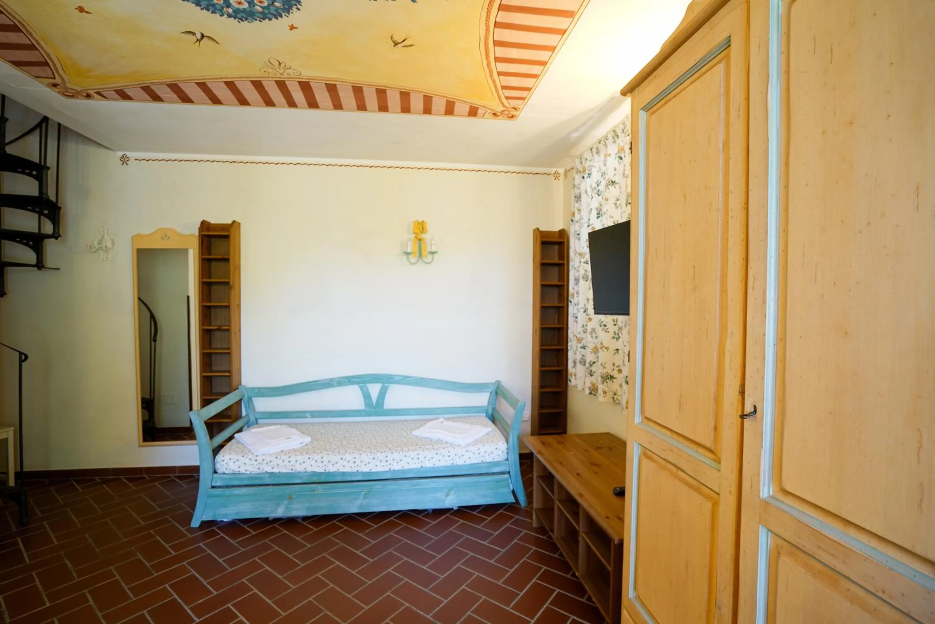 Living room, Bed in Residence Le Acacie