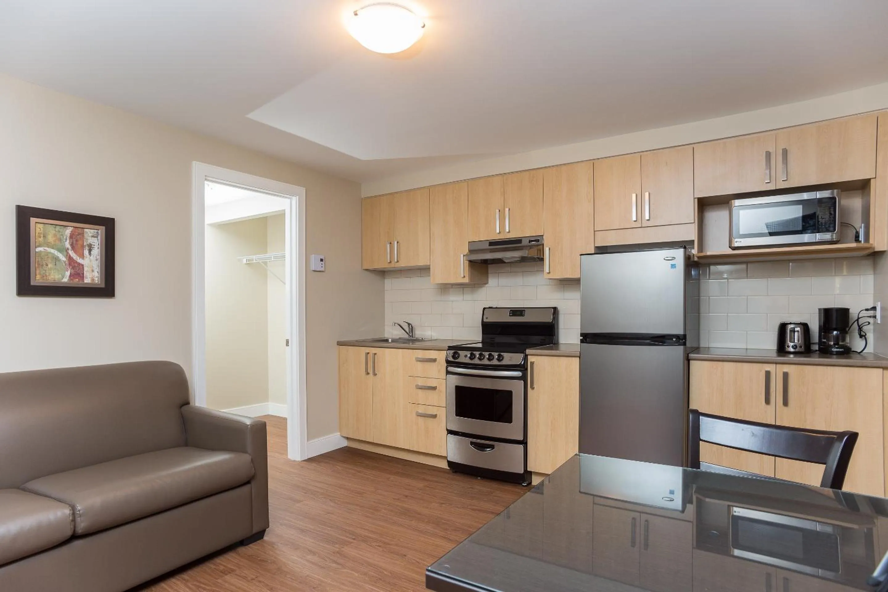 Kitchen or kitchenette in Motel Du Fleuve