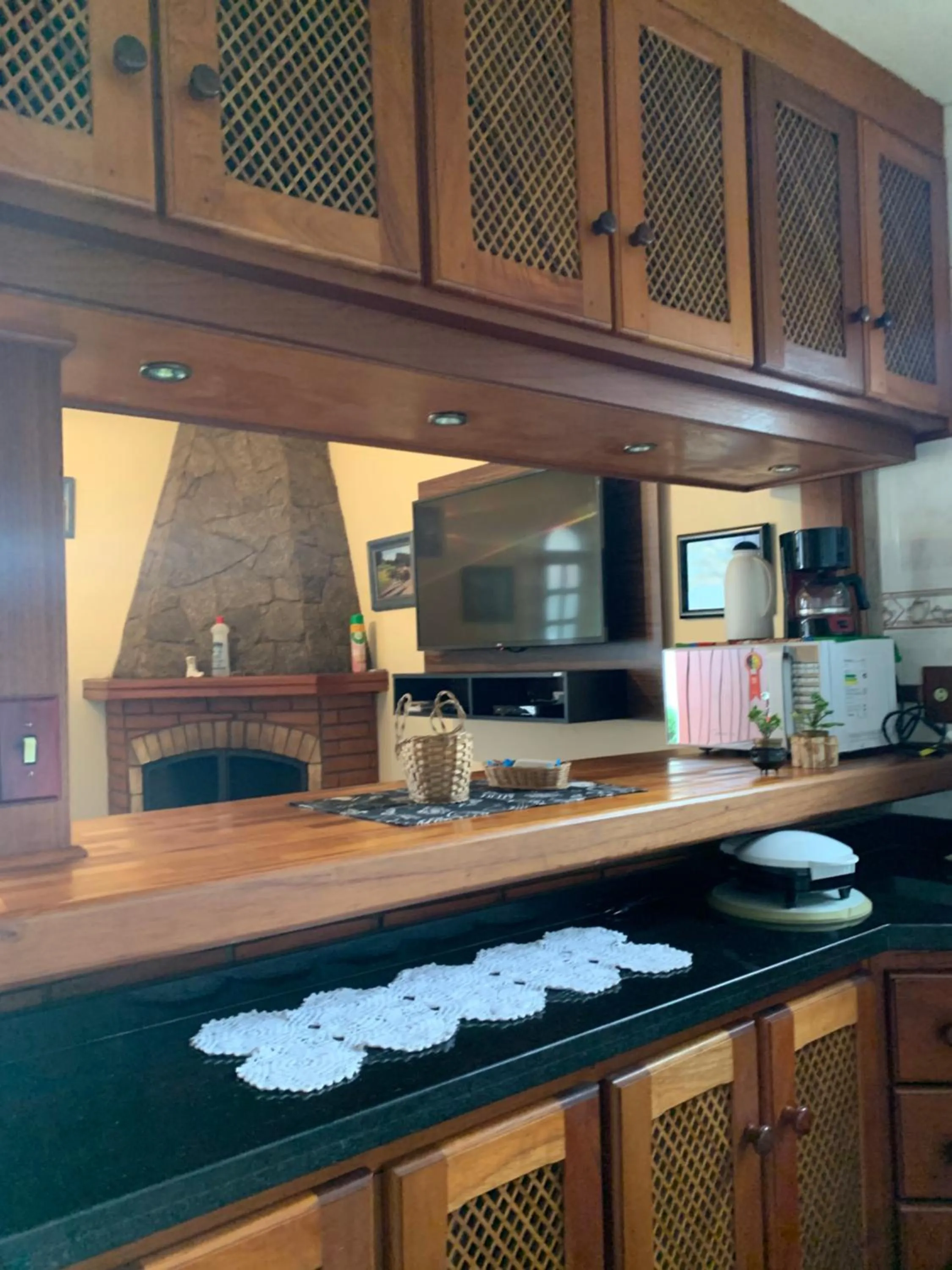 Kitchen or kitchenette in Chalé Dumont Pousadinha